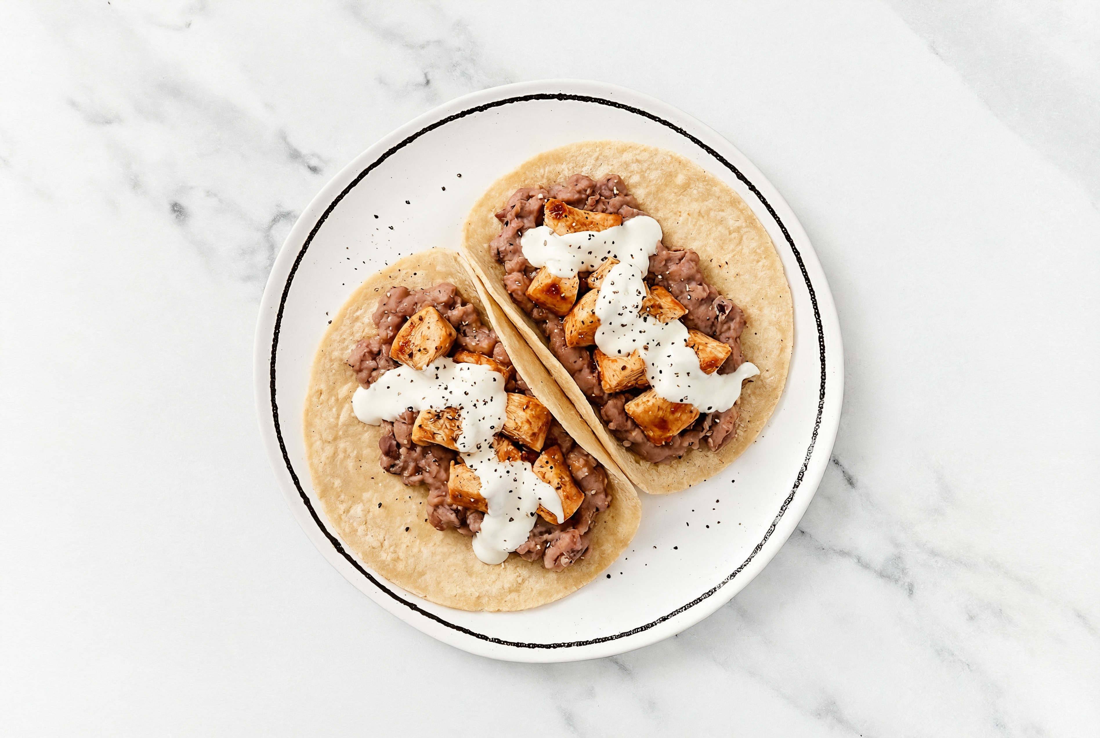 Chipotle Chicken Tacos with Crema & Refried Red Beans