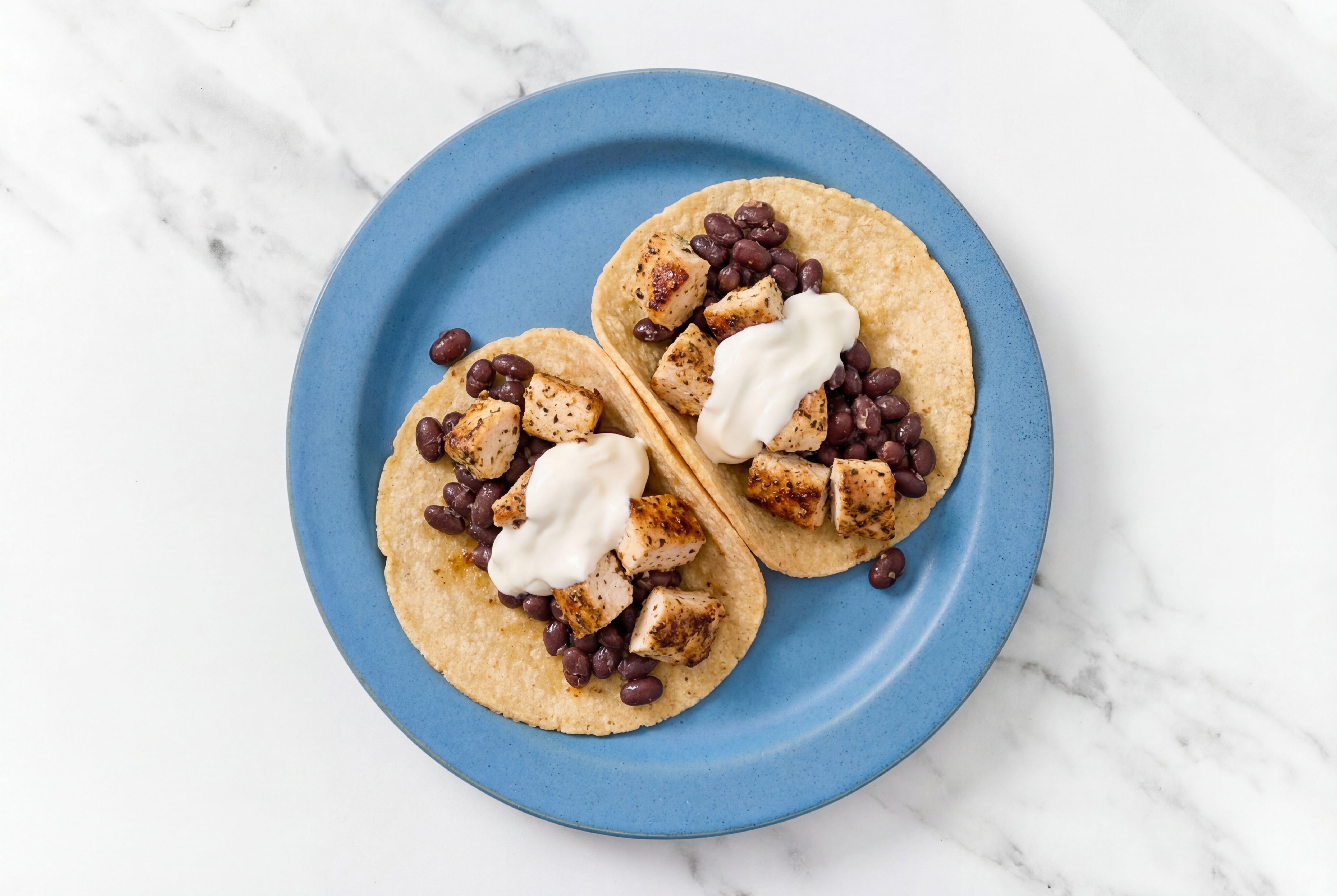 Garlic Chicken Tacos with Crema & Spiced Beans