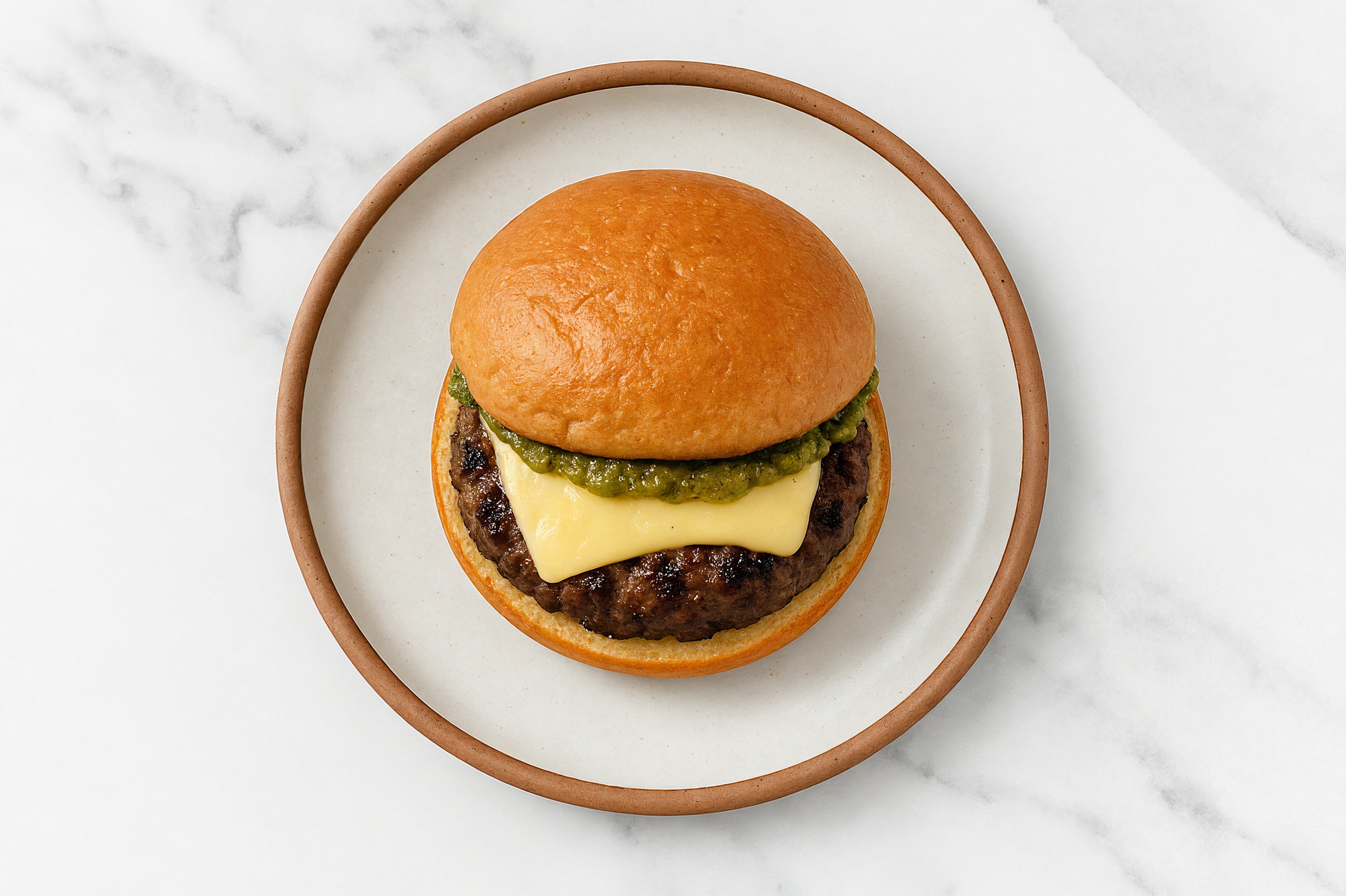 Ground Lamb Burger on Gluten-Free Bun with Pesto & Swiss