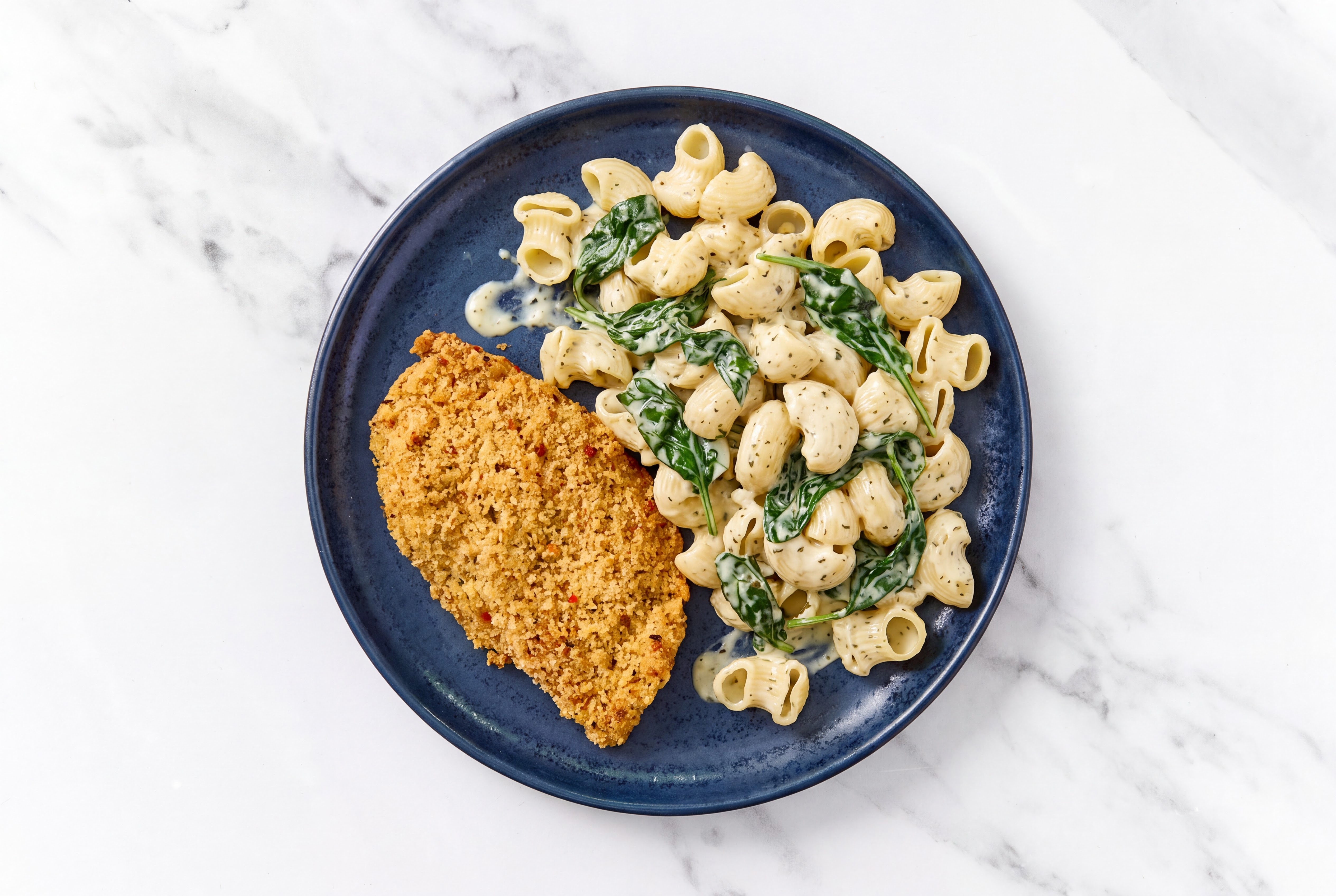 Crispy Garlic Chicken over Creamy Chiocciole Pasta with Baby Spinach