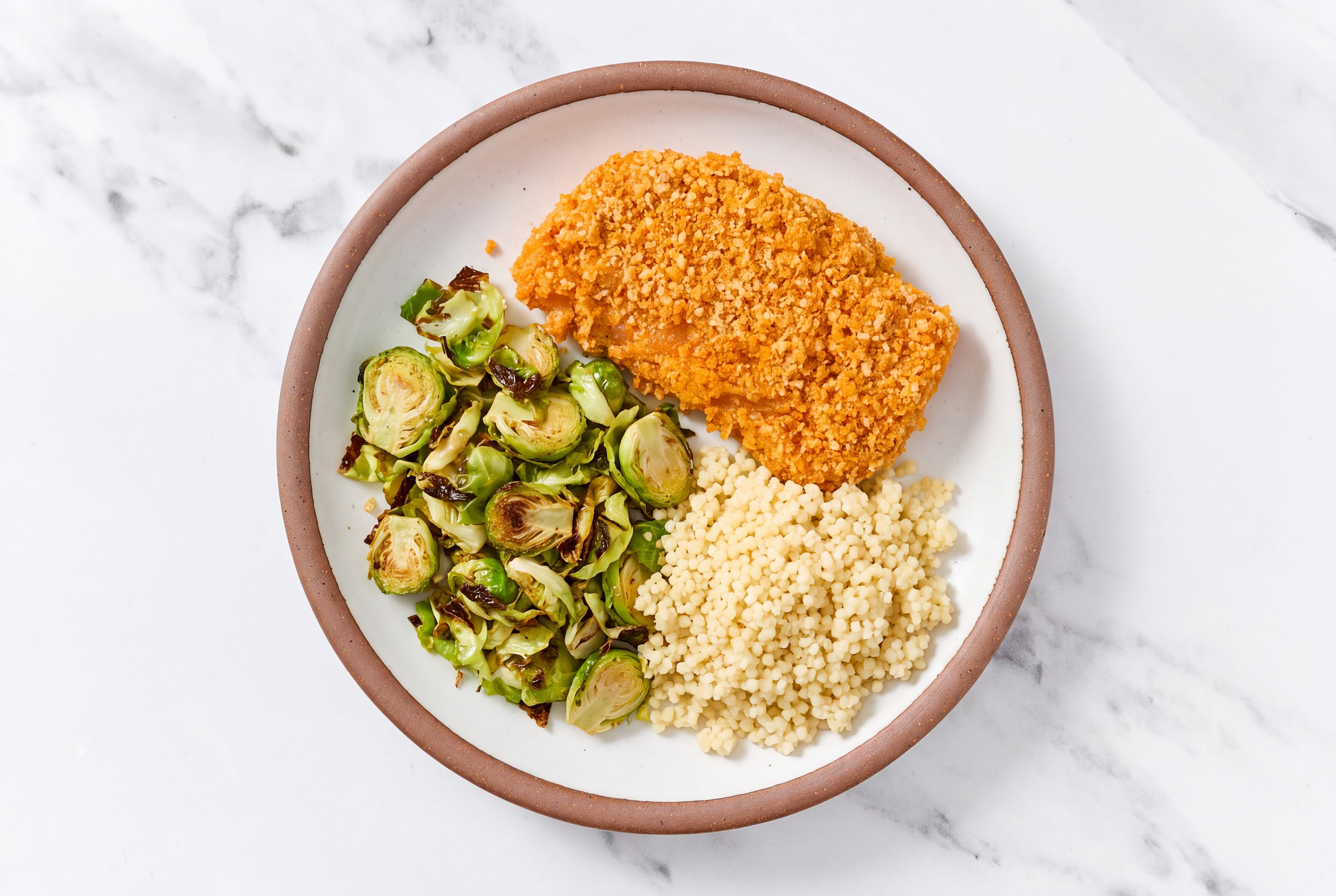 Hot Honey Breaded Chicken Cutlet with Brussels Sprouts & Couscous
