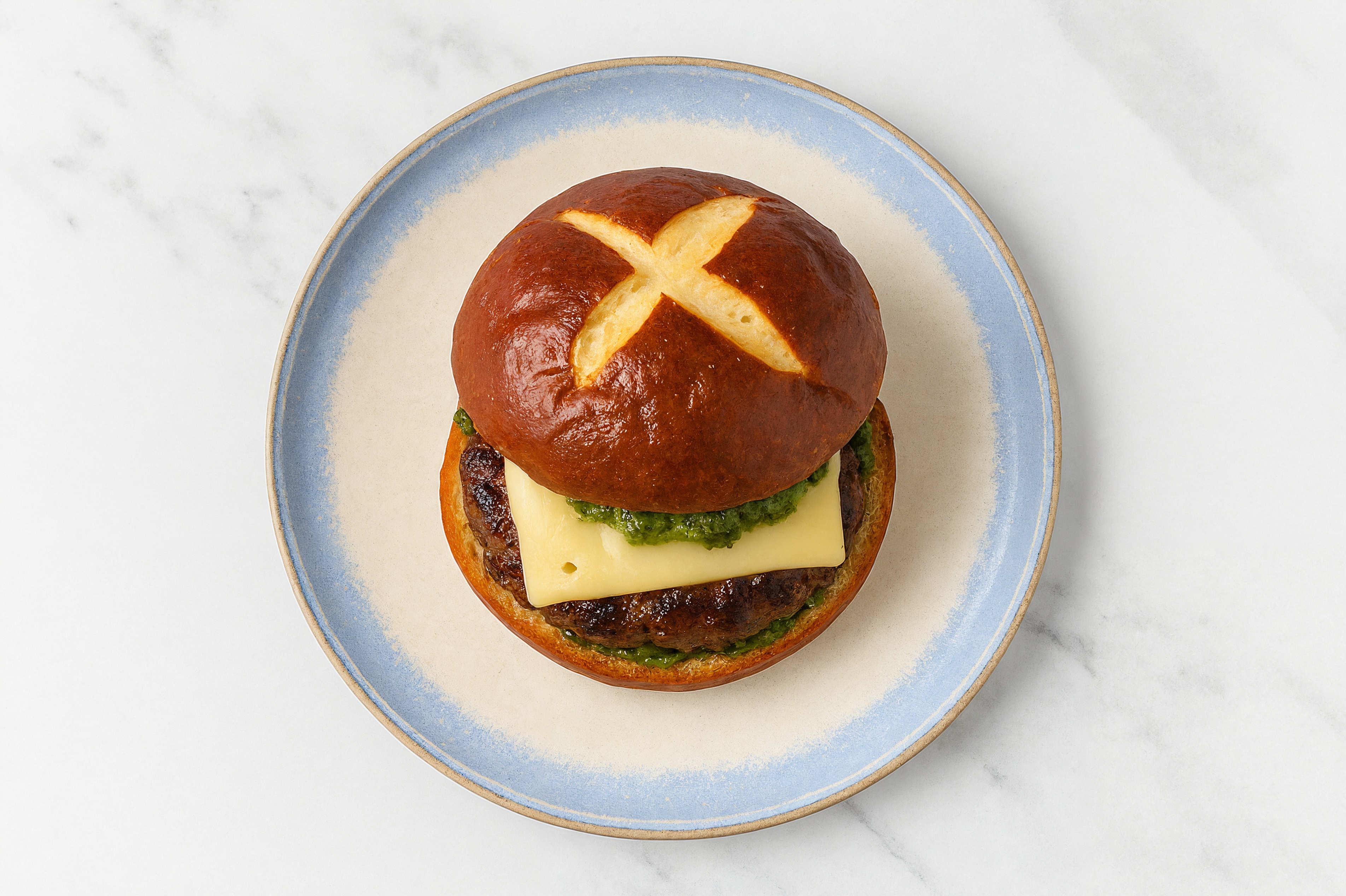 Bison Burger on Pretzel with Spinach Pesto & Swiss