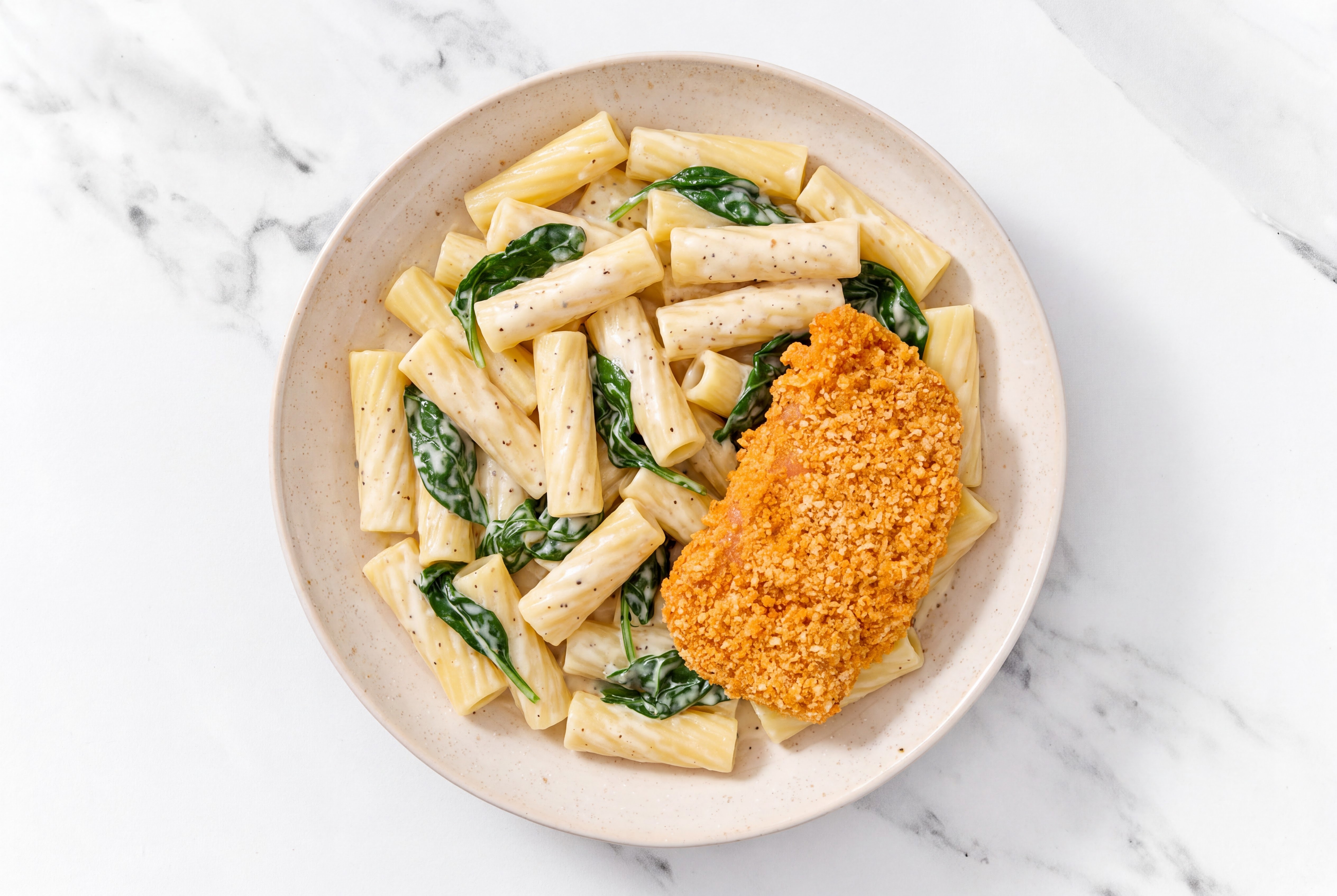 Crispy Hot Honey Chicken over Alfredo Rigatoni with Baby Spinach