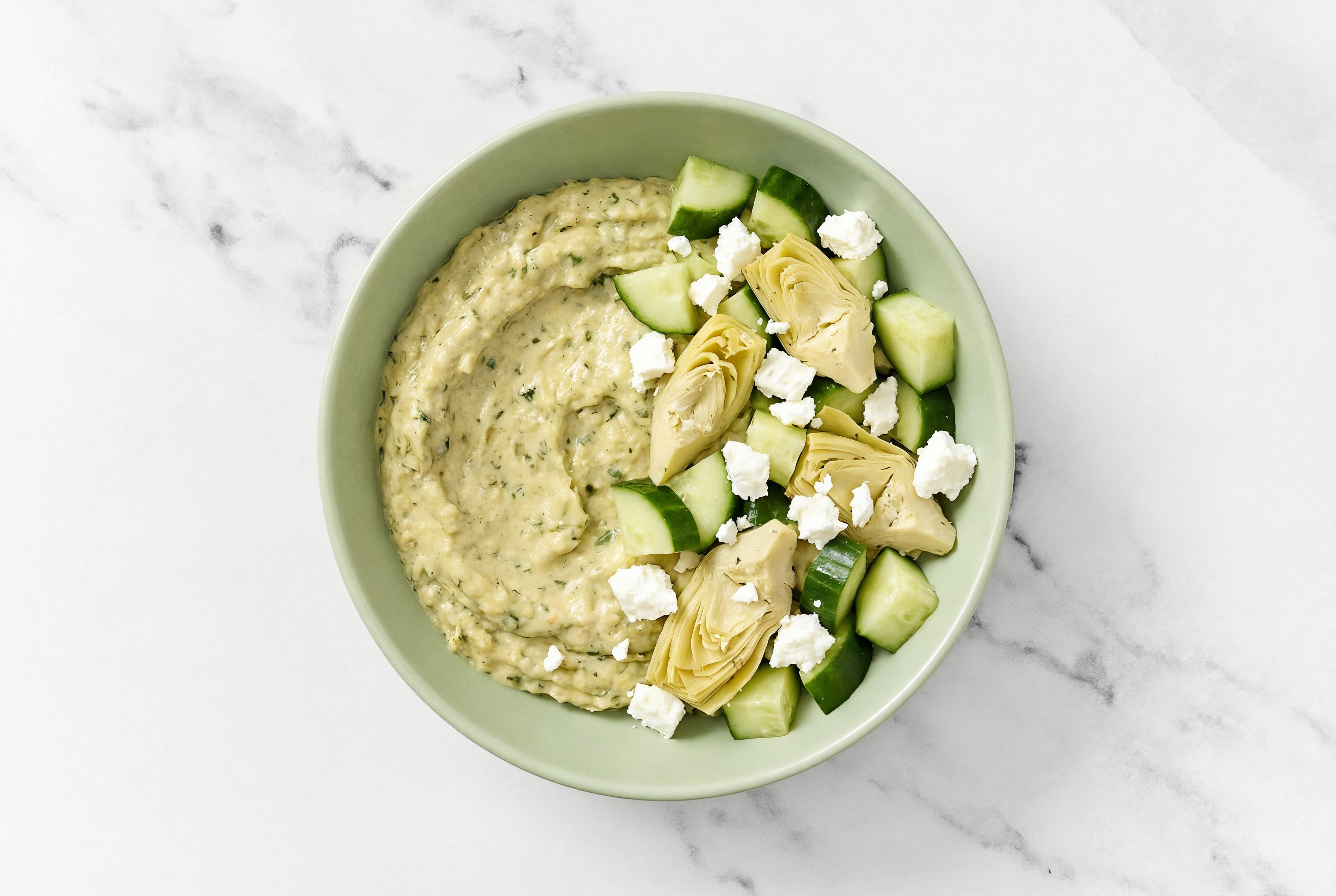 Feta Artichoke Cucumber Bowl over Spinach Artichoke Dip