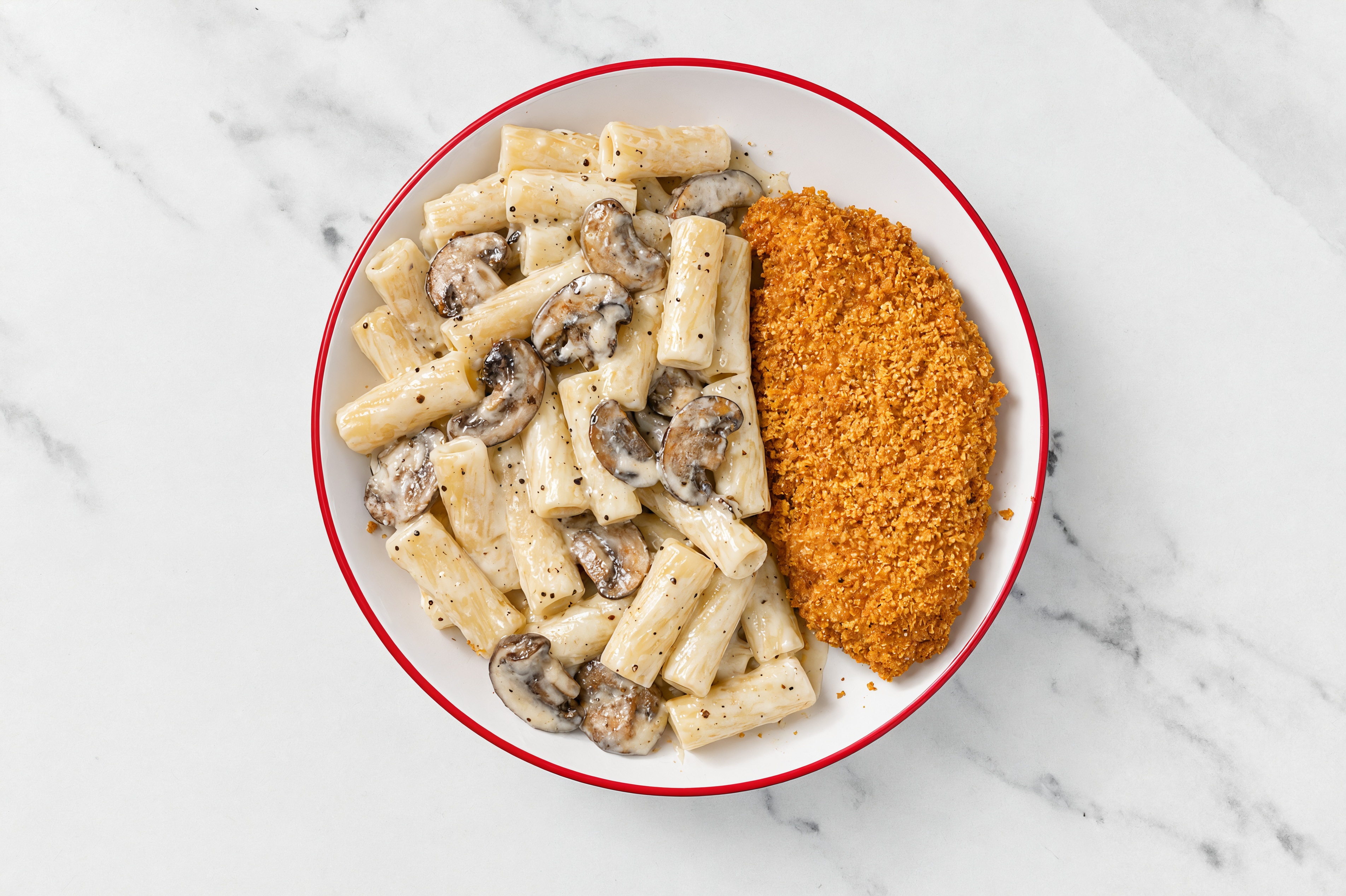 Crispy Hot Honey Chicken over Alfredo Rigatoni with Baby Bella Mushrooms