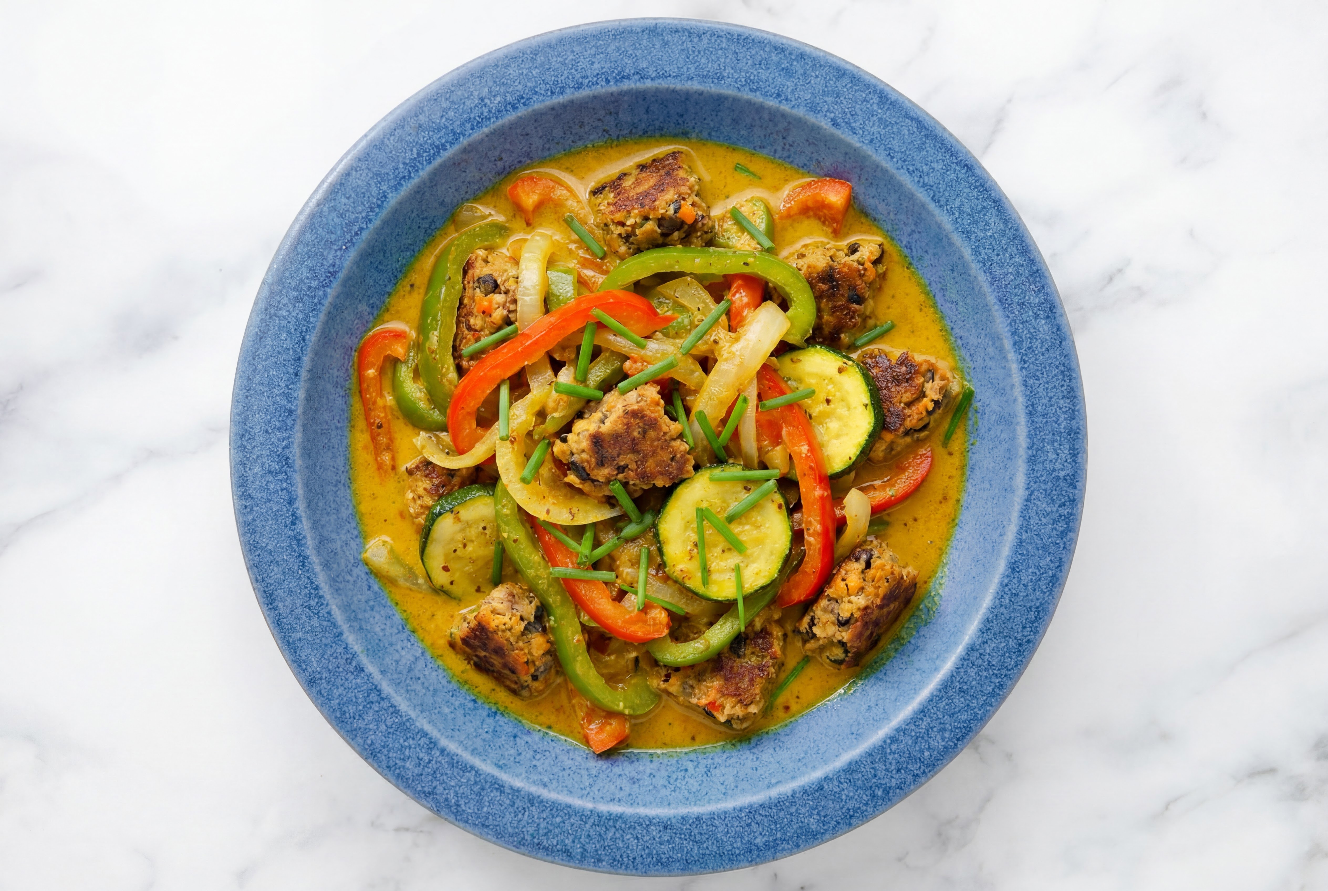 Bell Pepper + Zucchini Coconut Curry with Black Bean Patty Bites