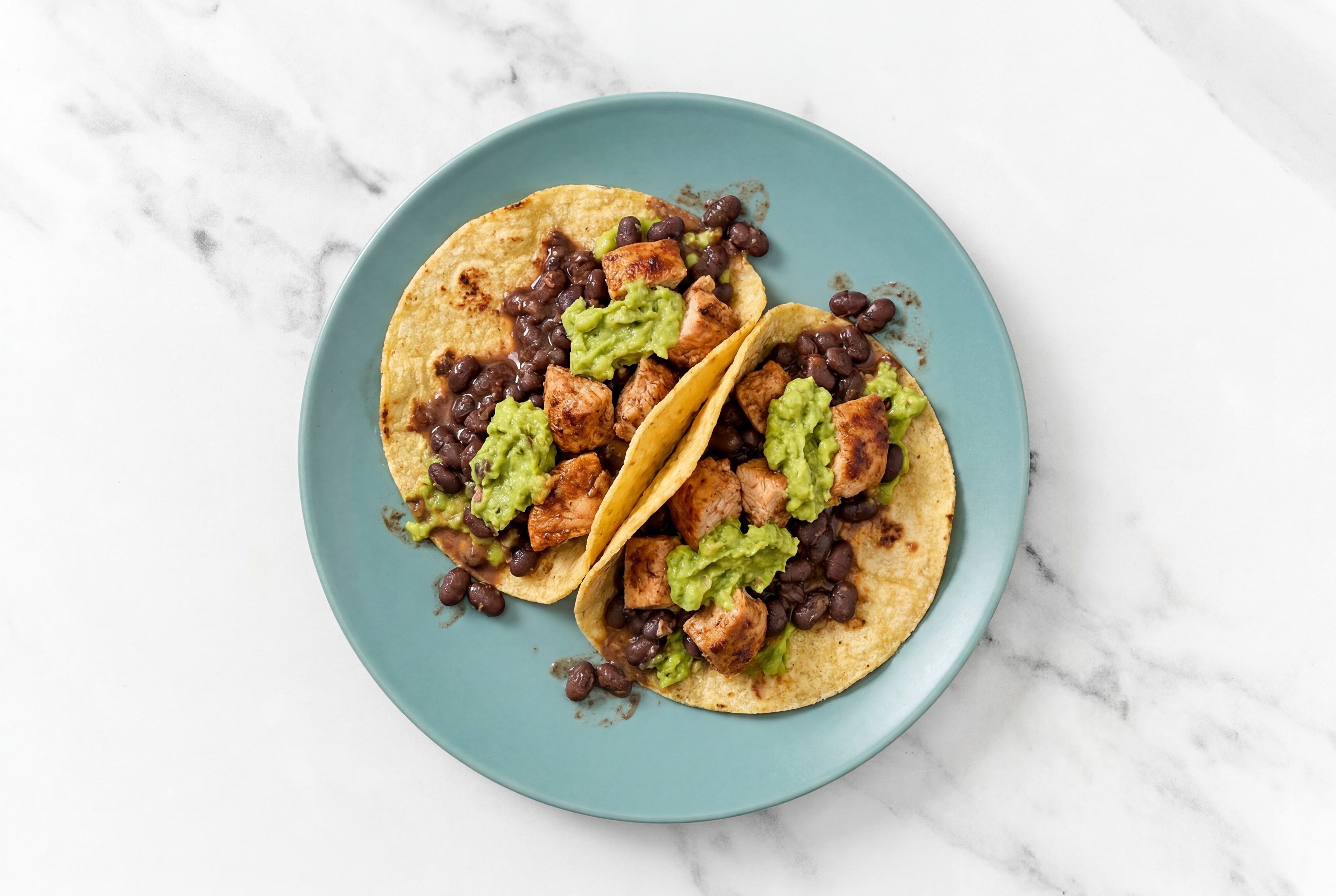 Herby Chipotle Chicken Tacos with Guacamole & Spiced Beans
