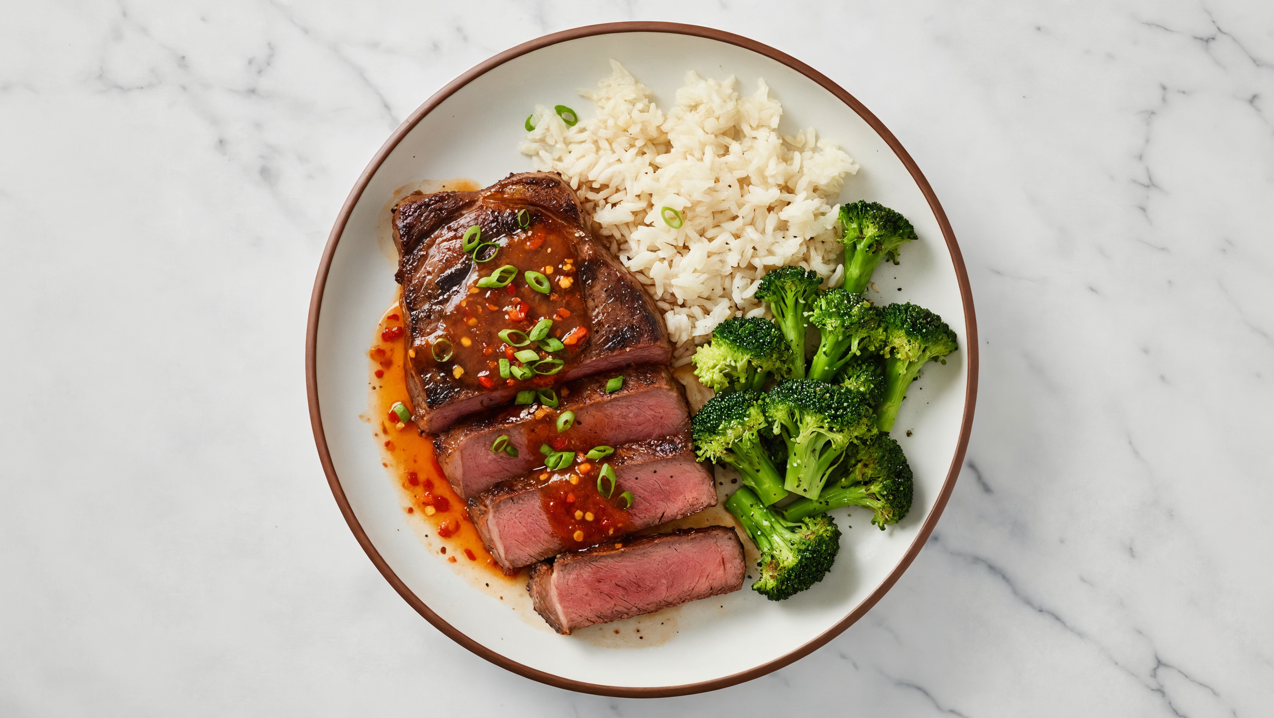 Seared Grass-Fed New York Strip Steak + Sweet Chili Lime Rice Bowl with Organic Broccoli