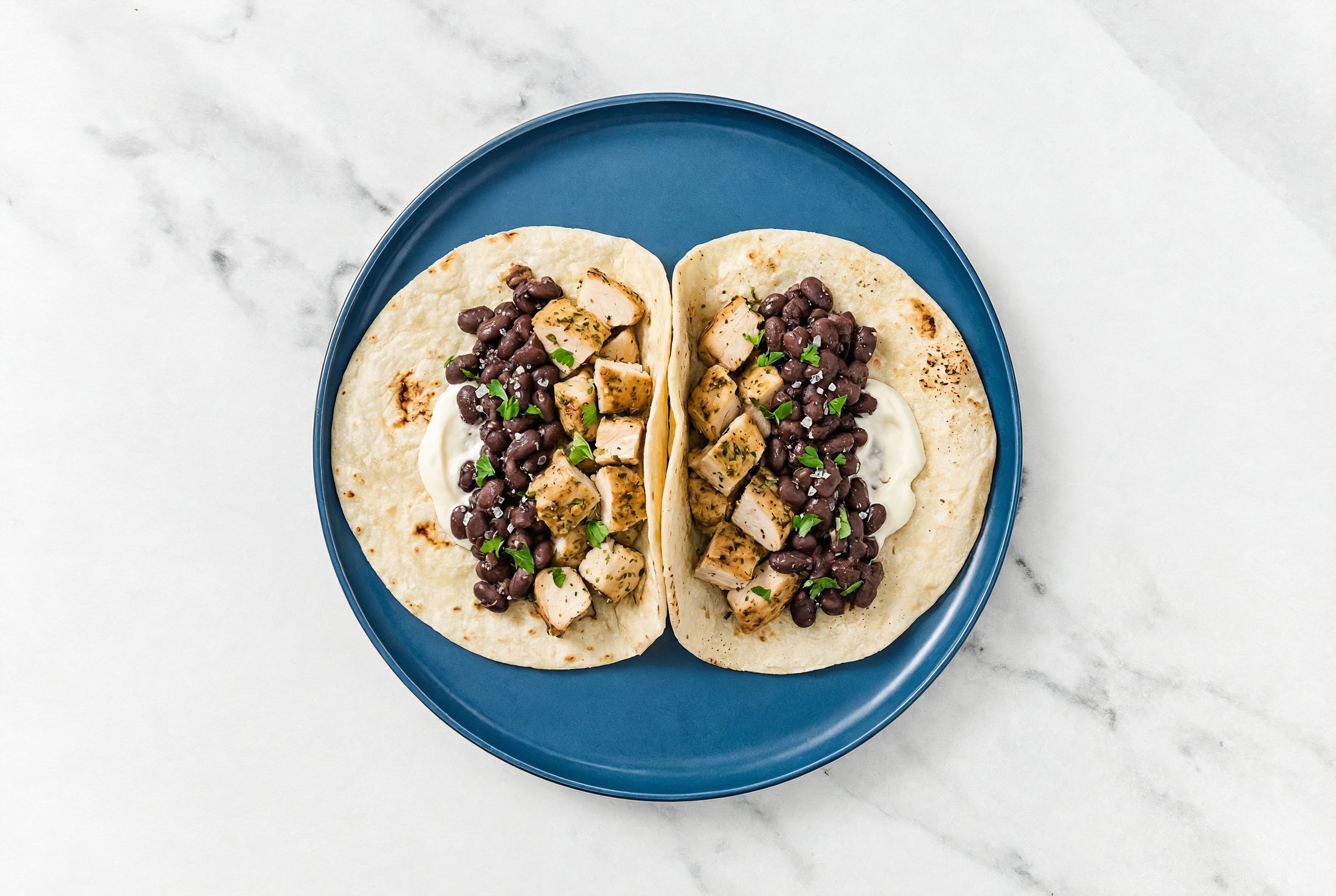 Garlic Chicken Tacos with Crema & Spiced Beans