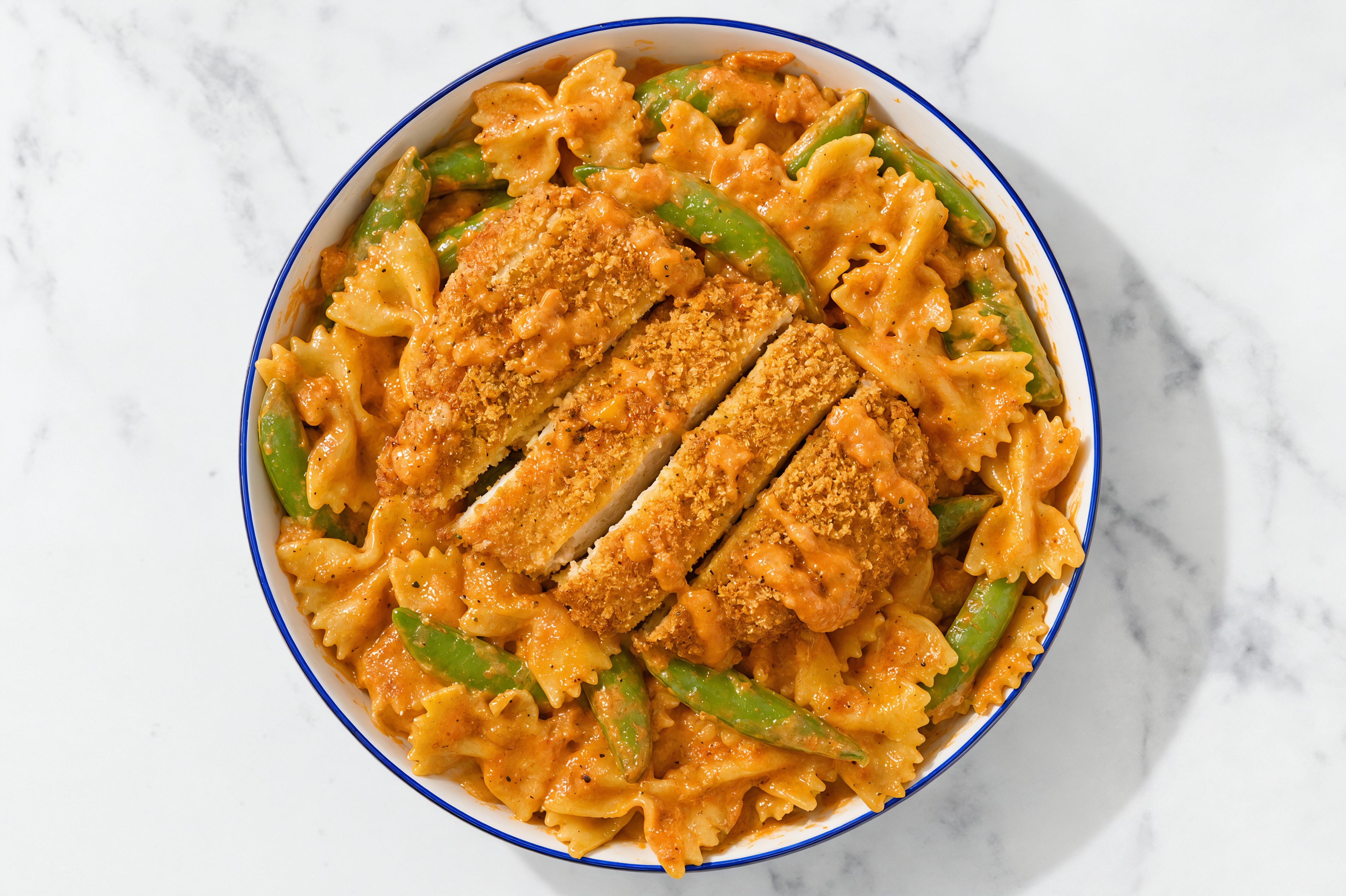Crispy Hot Honey Chicken over Creamy Vodka Farfalle with Snap Peas