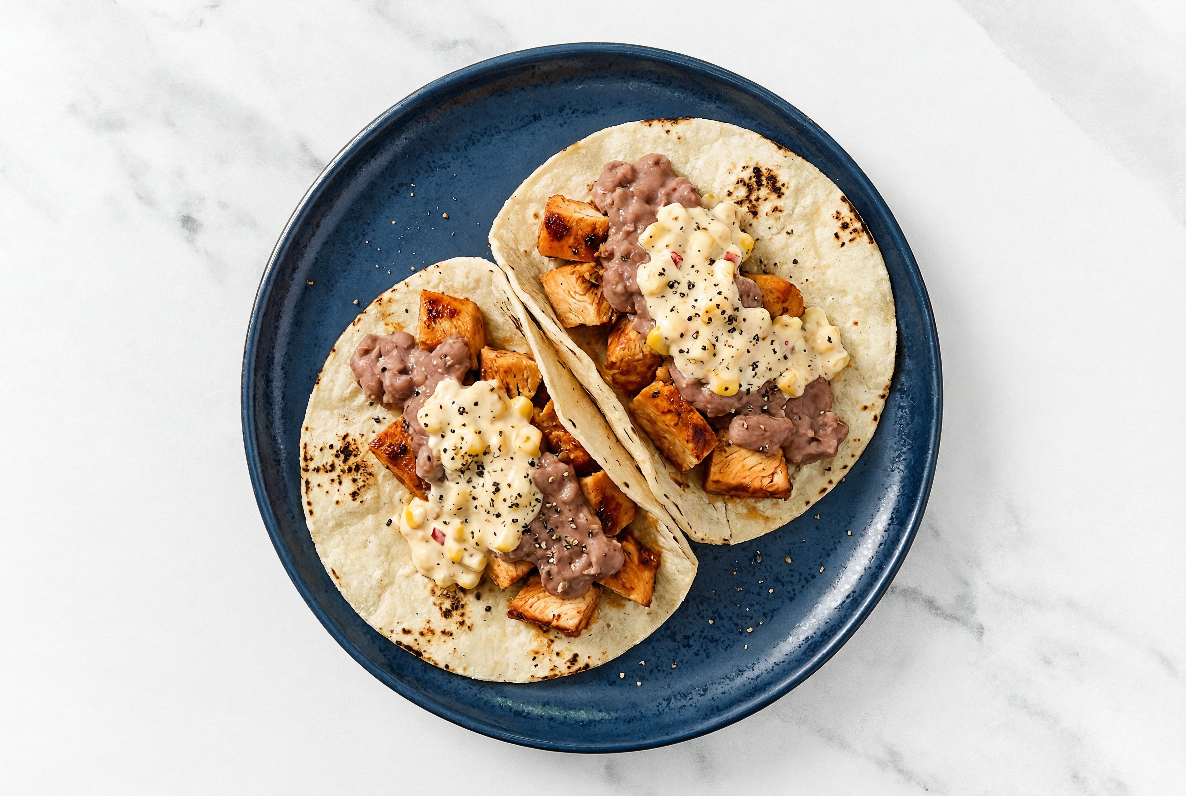 Chipotle Chicken Tacos with Street White Corn Tortillas Sauce & Refried Red Beans