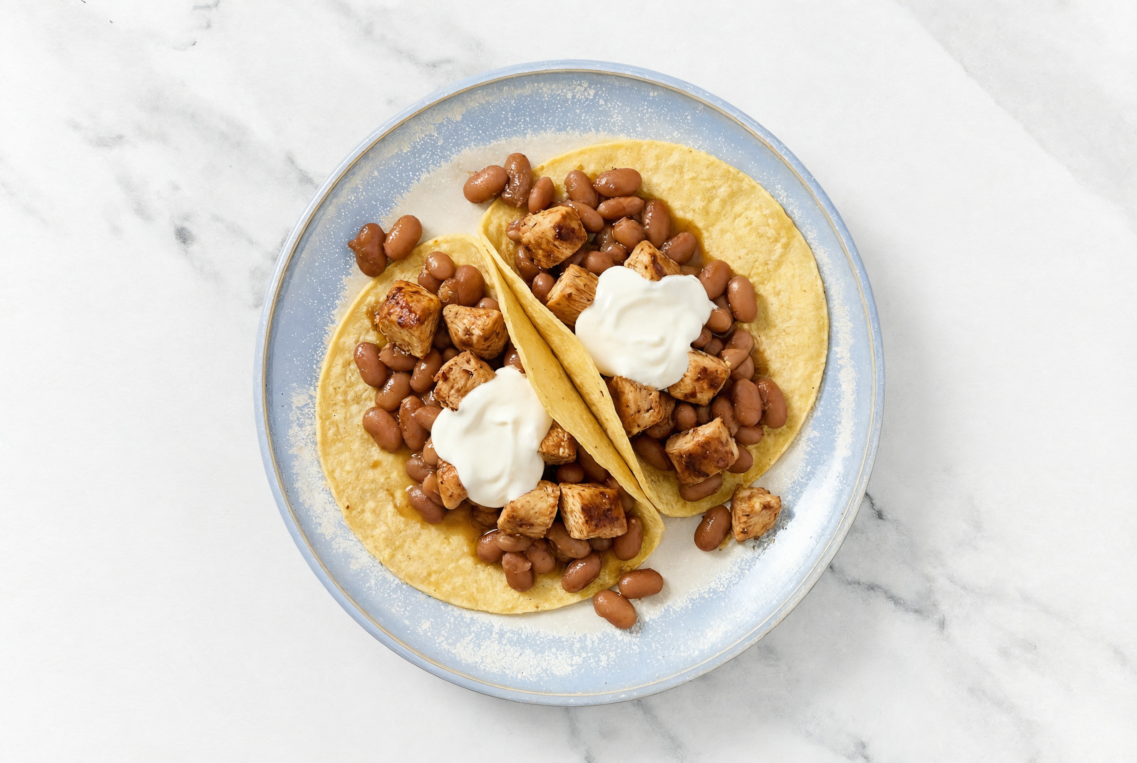 Herby Chipotle Chicken Tacos with Crema & Pinto Beans