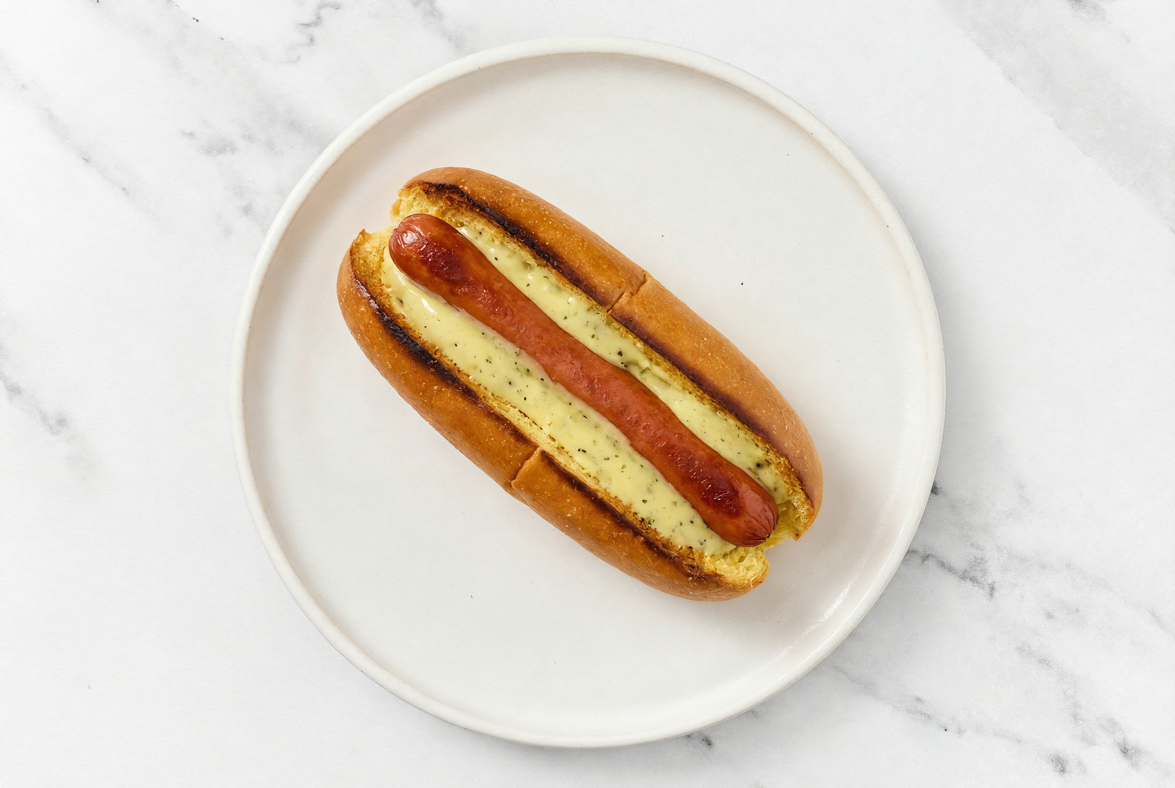 Beef Hot Dog with Honey Musard Garlic Sauce on Brioche