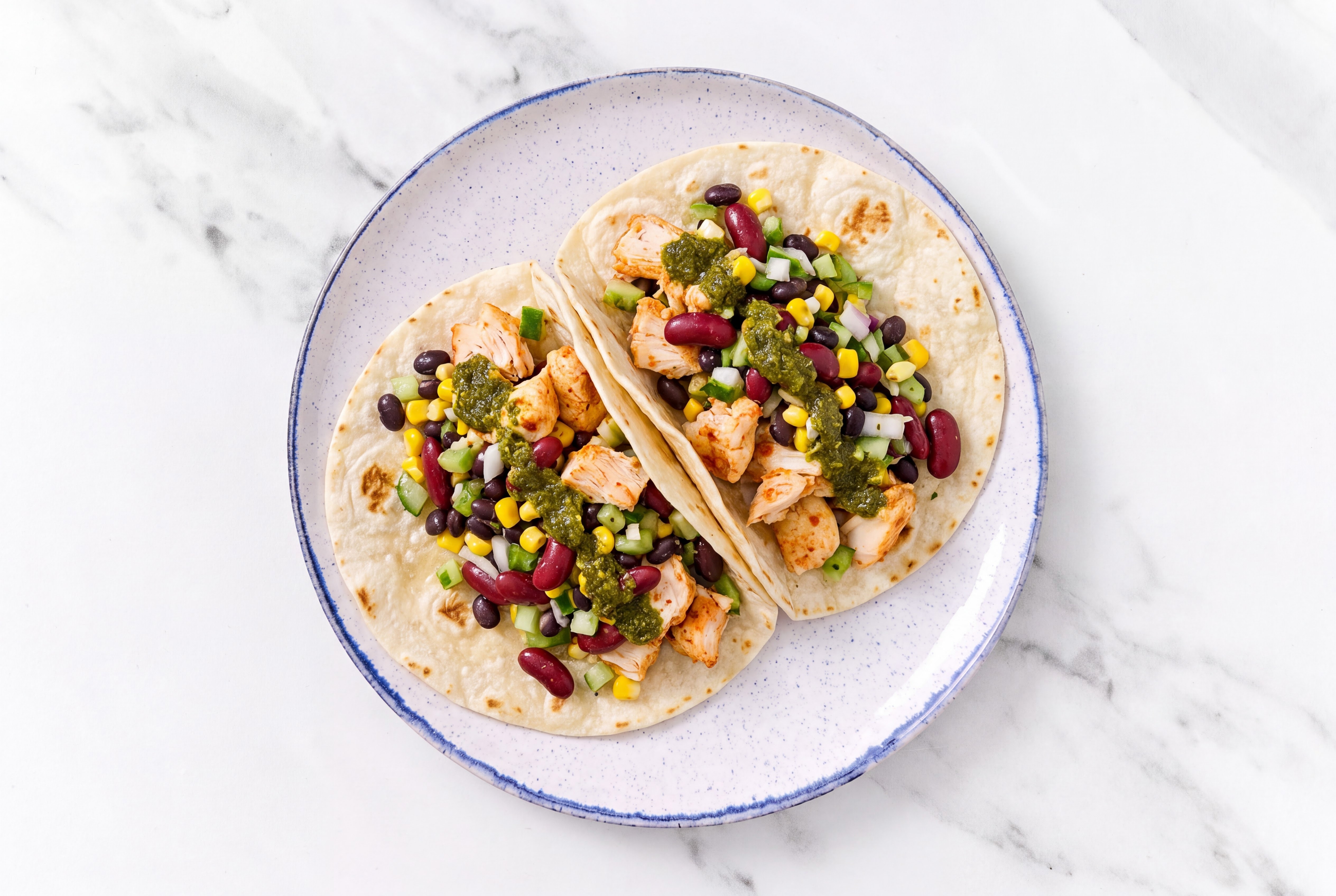 Zhoug Chile Chicken + Bean Tacos