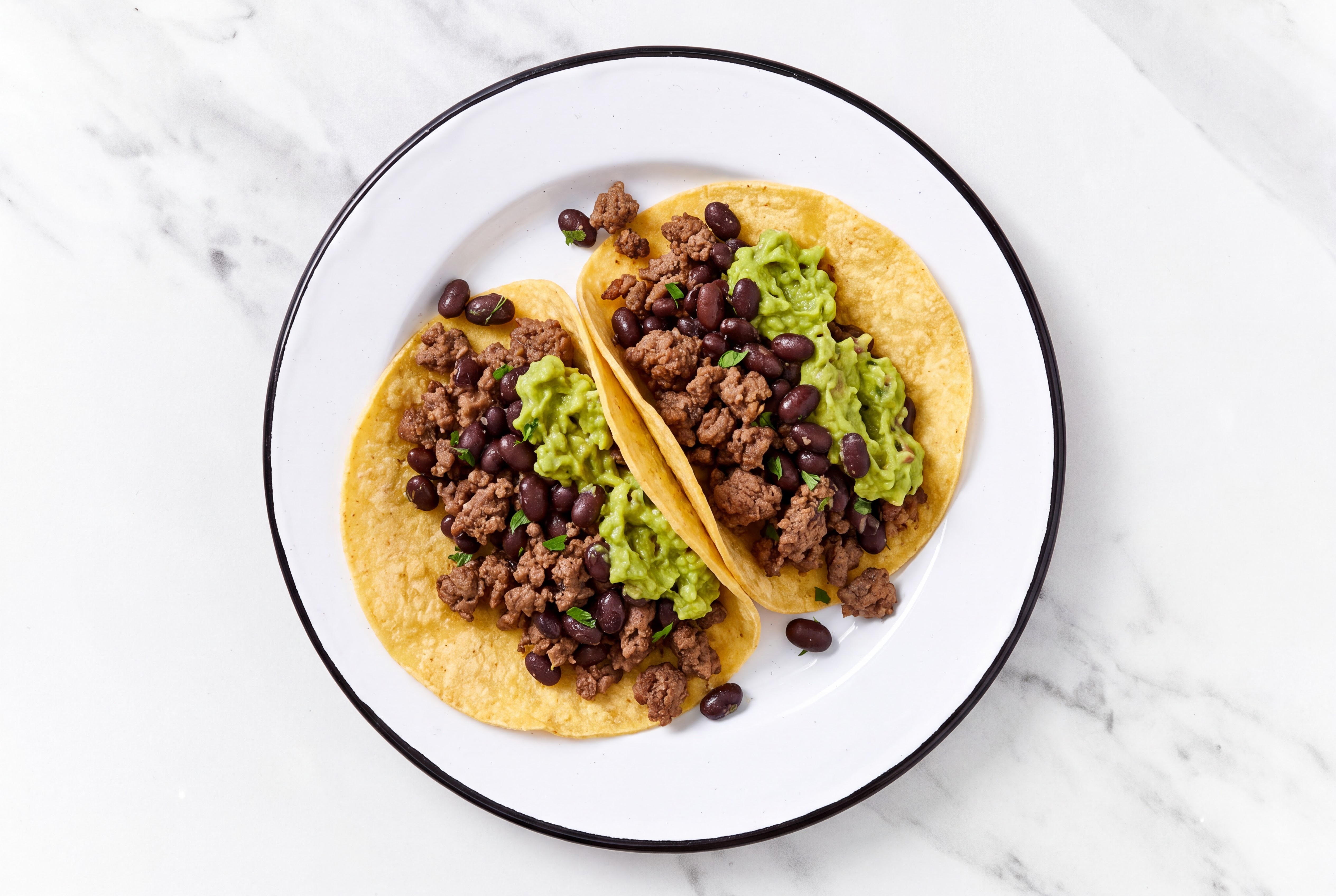Herby Ground 93/7 Lean Beef Tacos with Guacamole & Spiced Beans