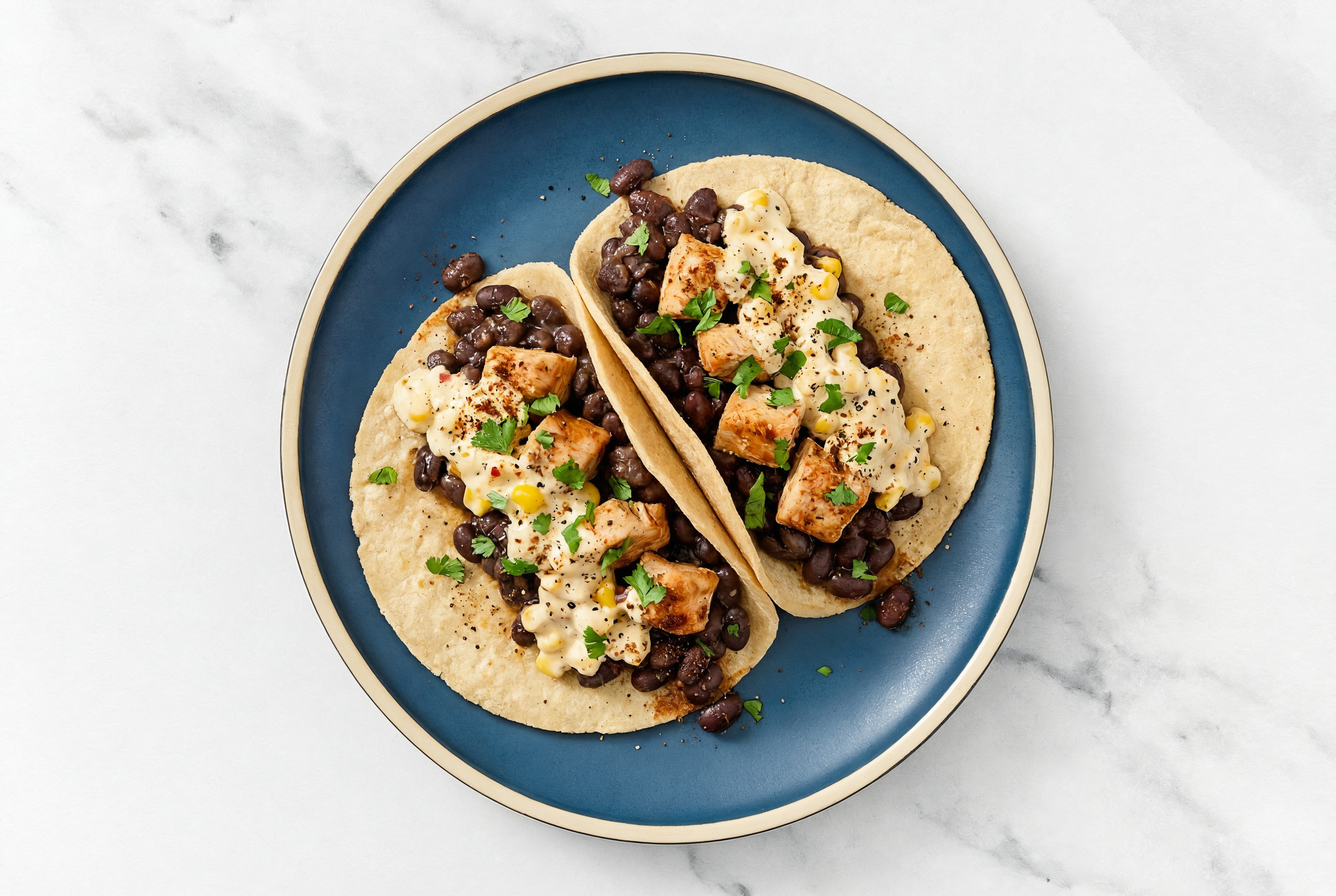 Chipotle Chicken Tacos with Street Corn Sauce & Spiced Beans
