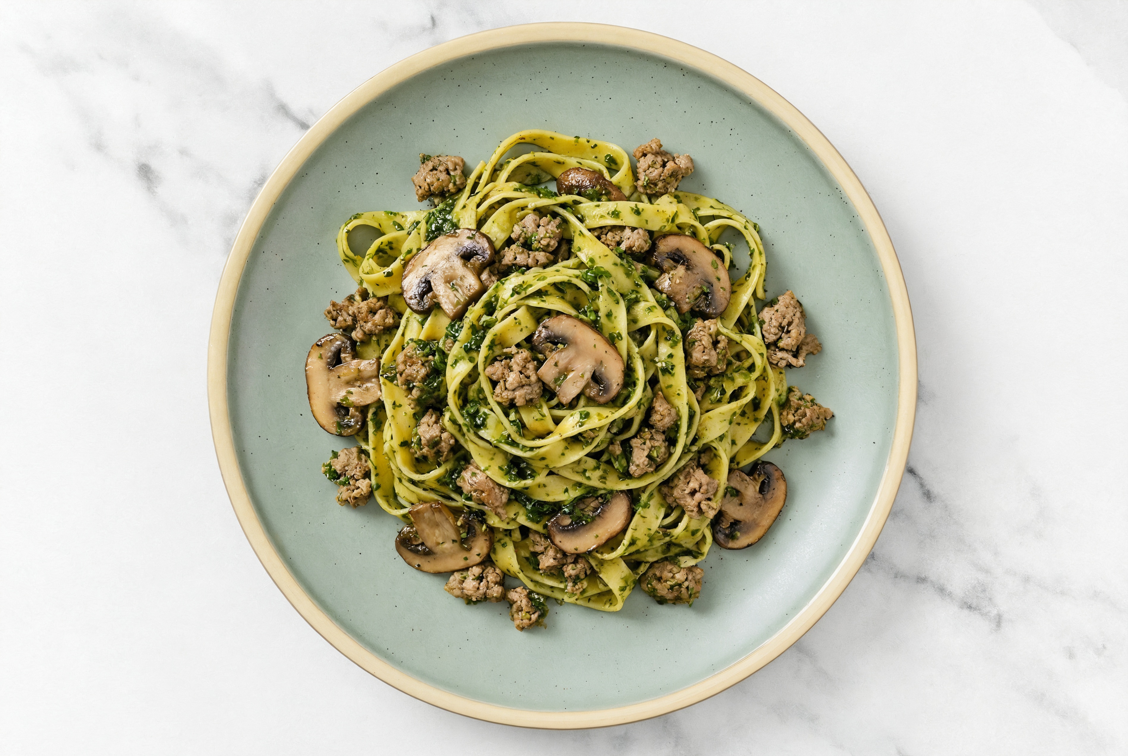 Tagliatelle Kale Pesto with Ground Lamb & Mushrooms