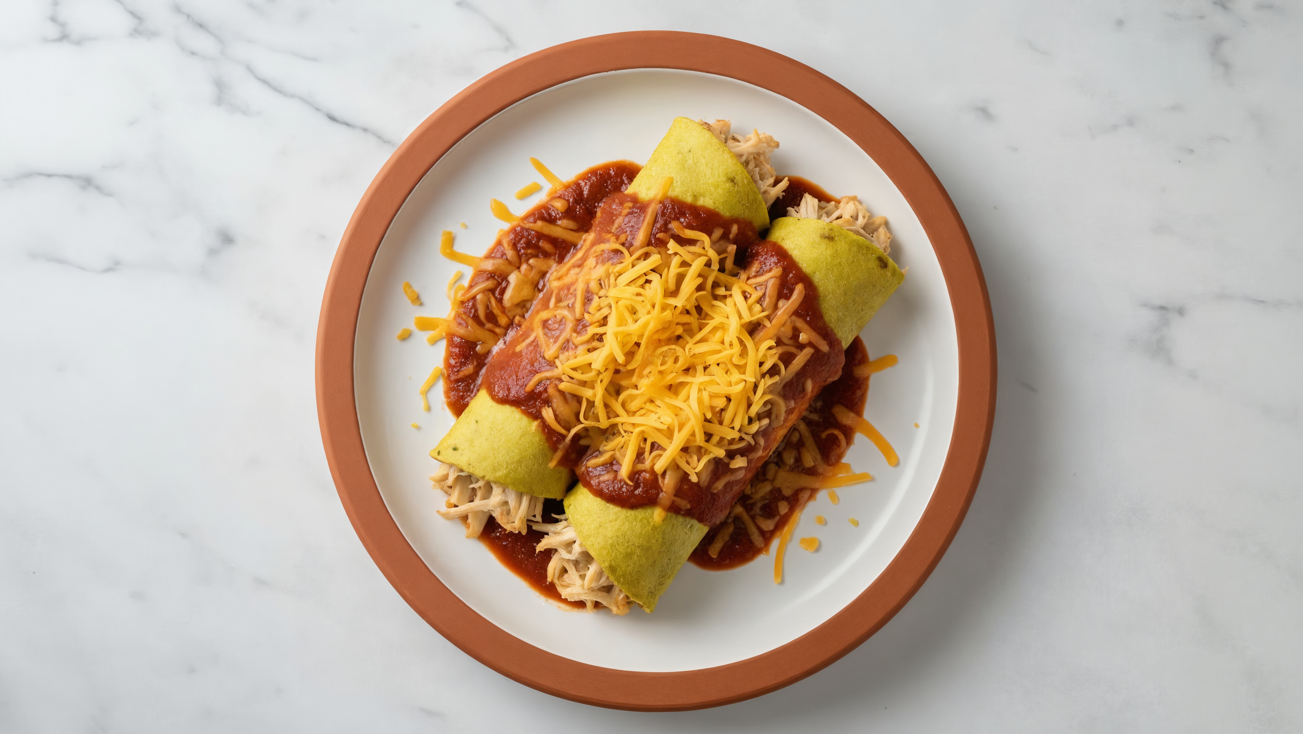 Rustic Cheesy Pulled Chicken Enchiladas Rojas with Shredded Sharp Cheddar Cheese