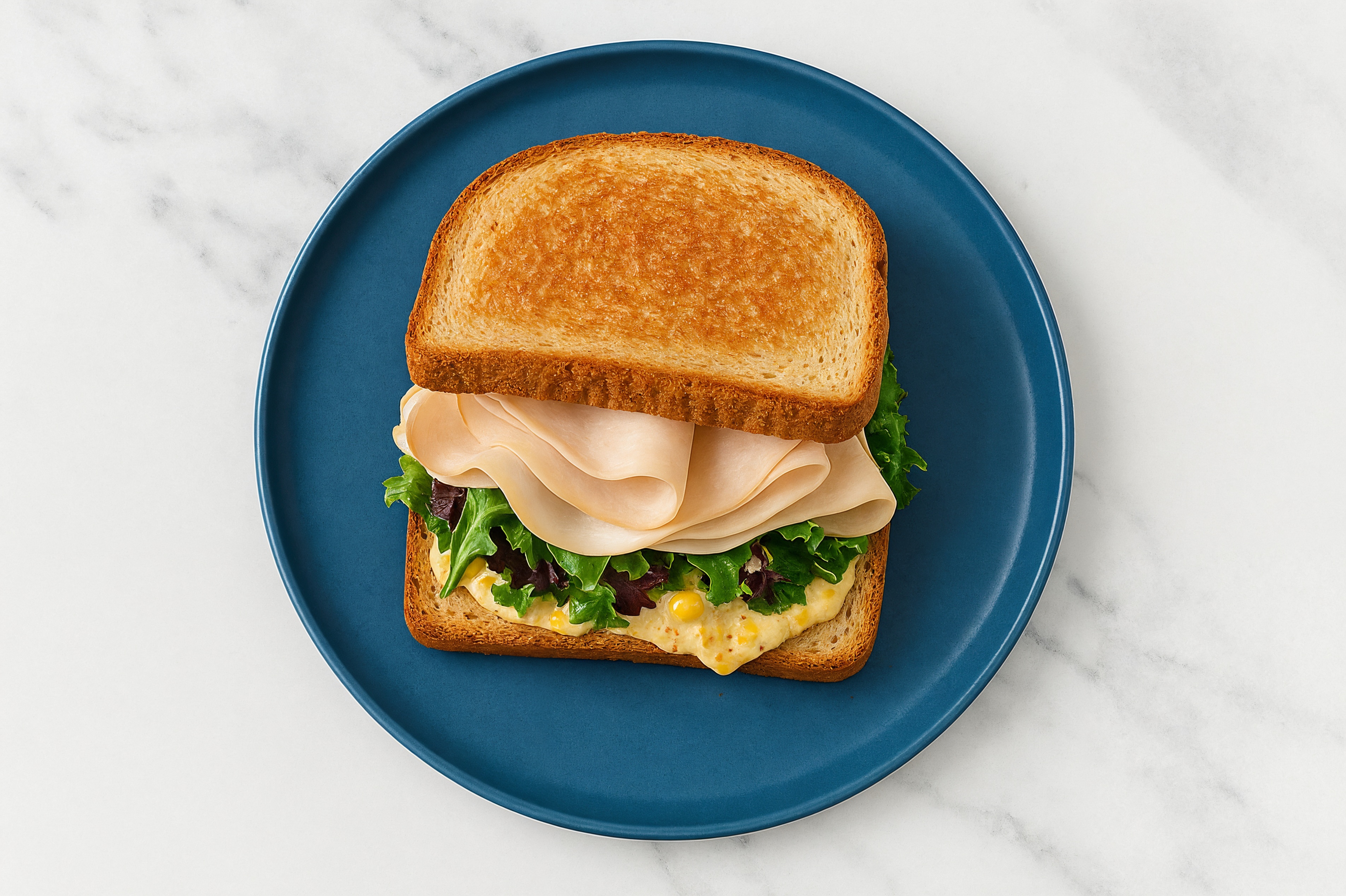 Street Corn Roasted Turkey Sandwich with Spring Mix on Honey White Bread