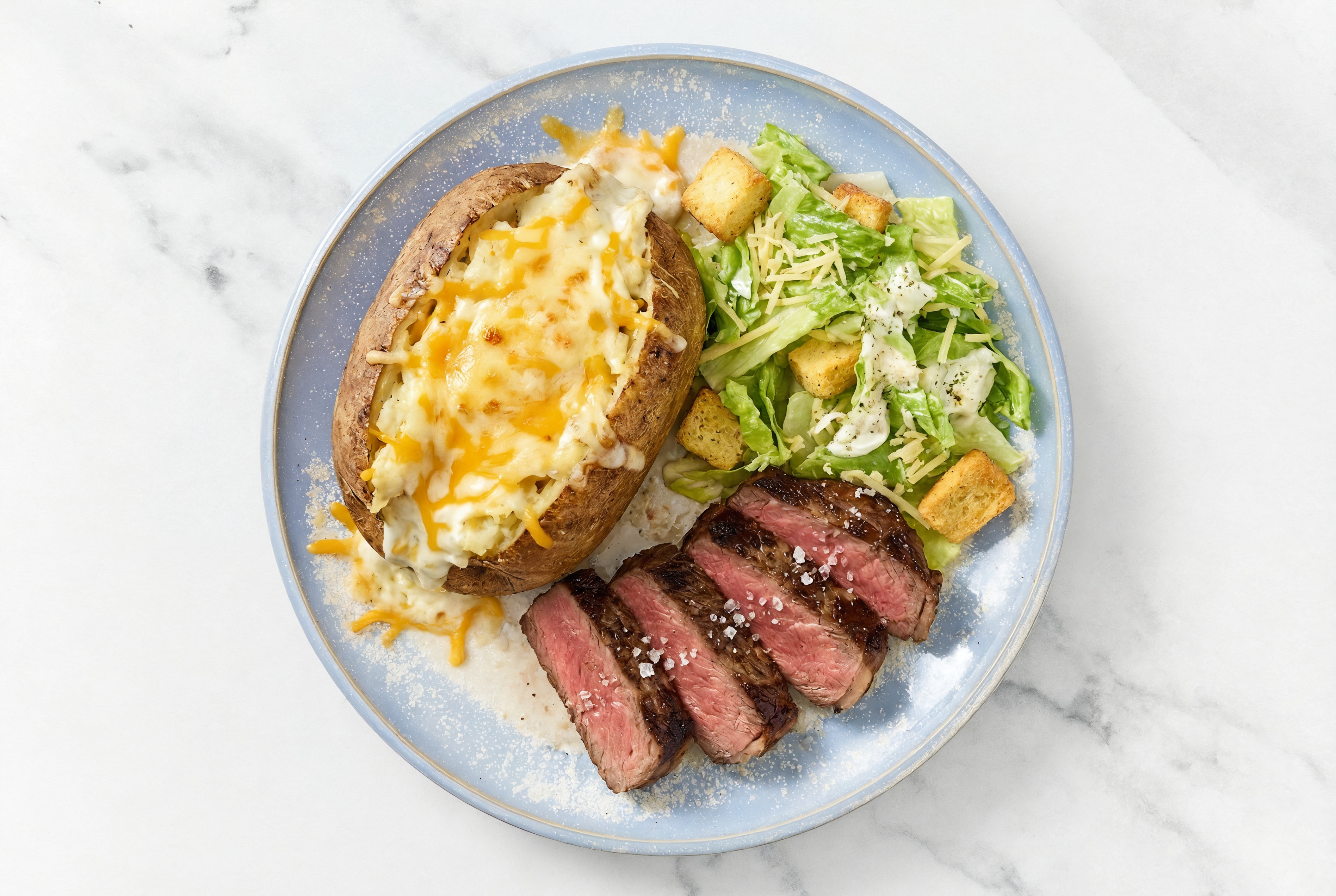 Wagyu Strip Steak with Caesar Salad + Twice-Baked Potato with Shredded Sharp Cheddar Cheese