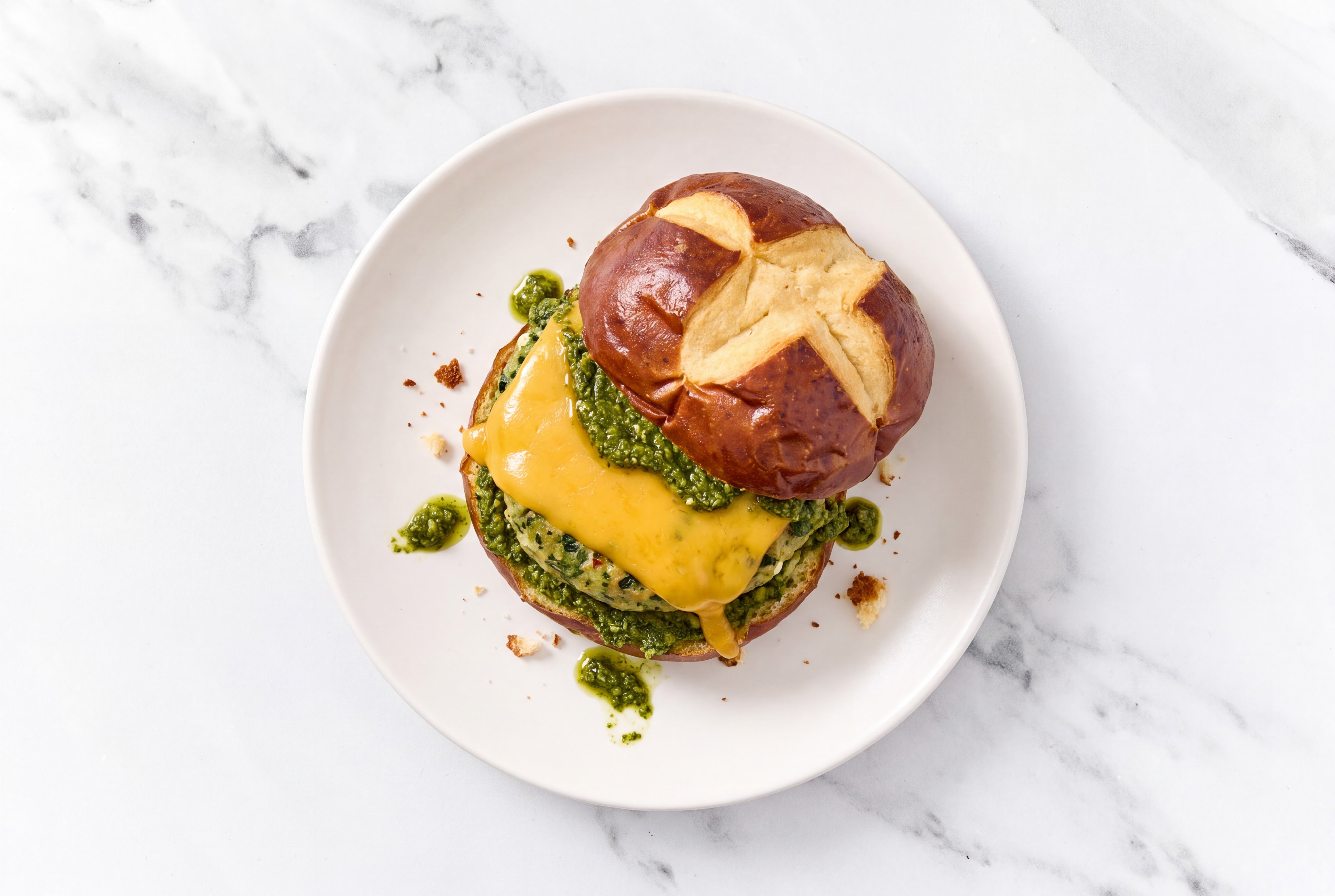 Garlic Turkey Burger on Pretzel with Spinach Pesto & Cheddar