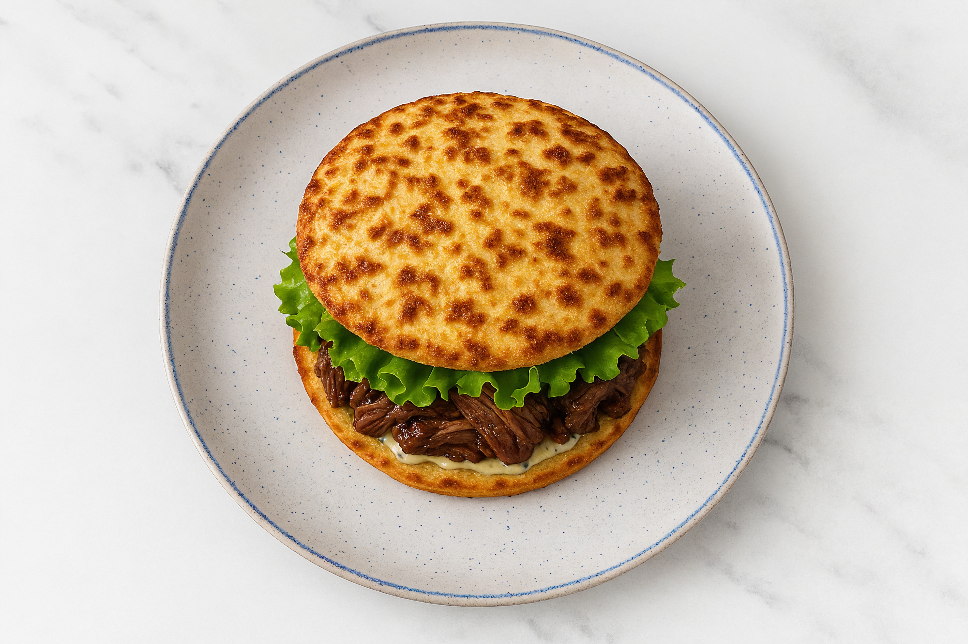 Dill Pickle Beef Short Rib Sandwich with Green Leaf Lettuce on Cauliflower Rounds