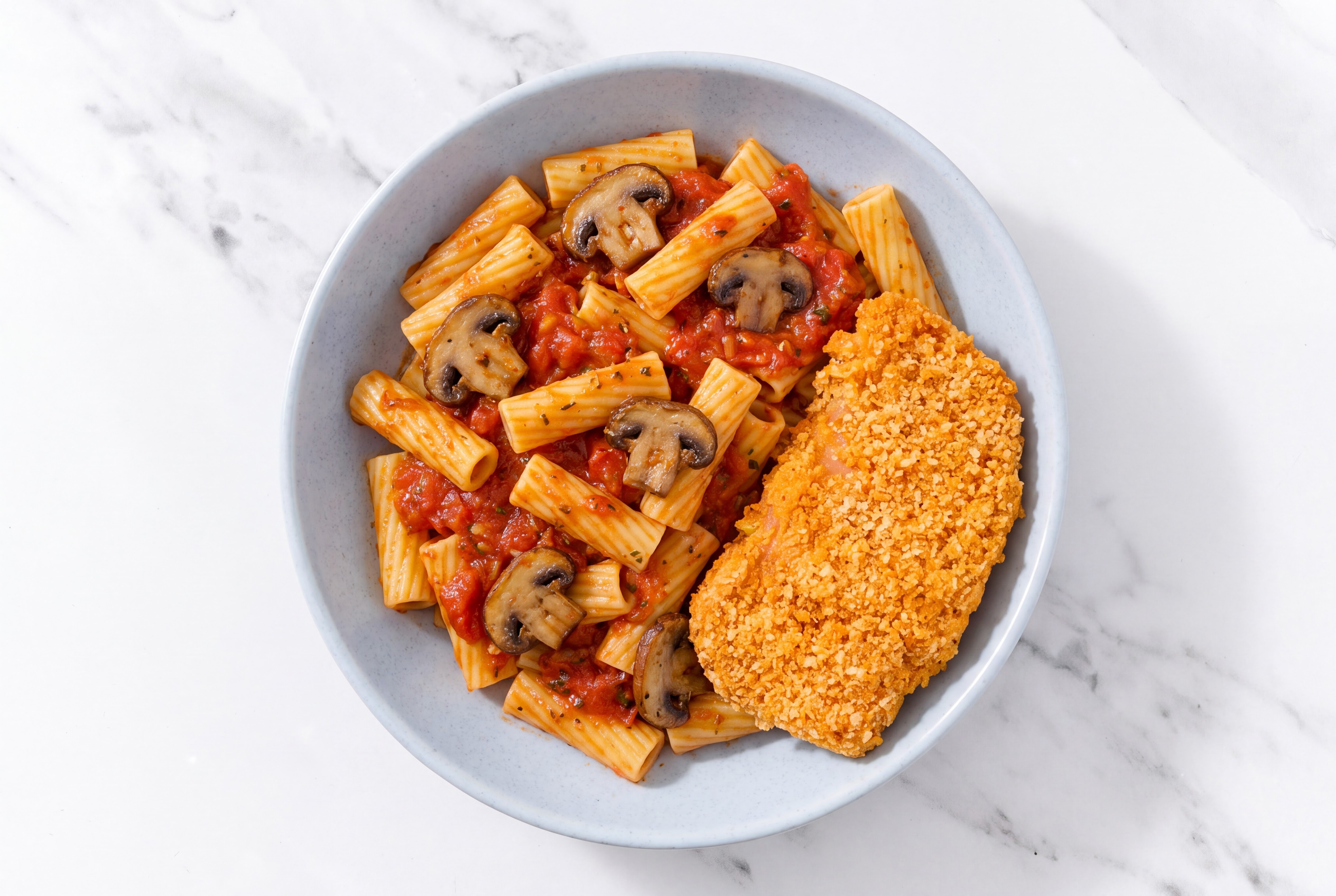 Crispy Hot Honey Chicken over Marinara Rigatoni with Baby Bella Mushrooms