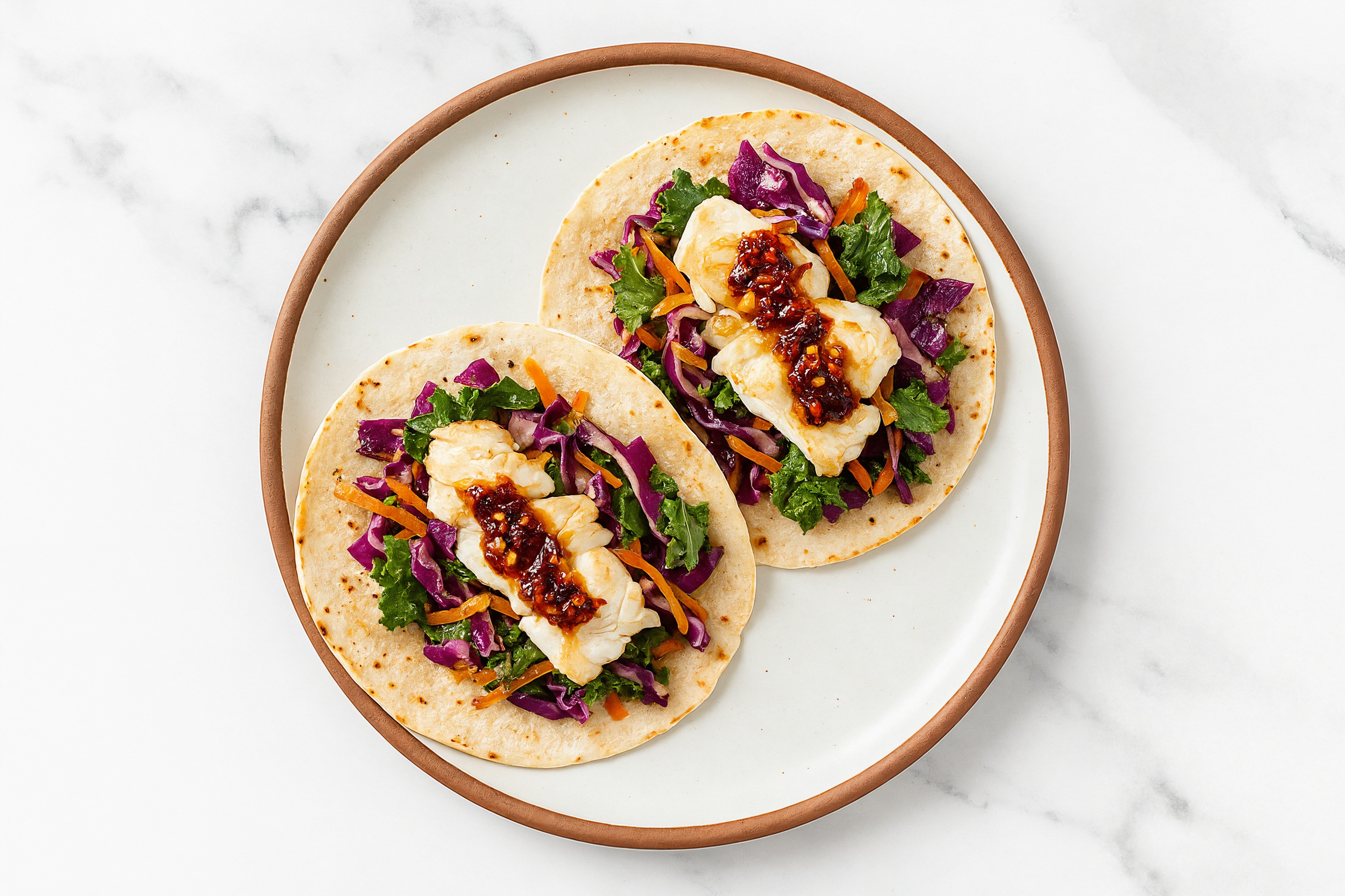 Chili Crisp Lime Halibut Tacos with Sautéed Kale Mix