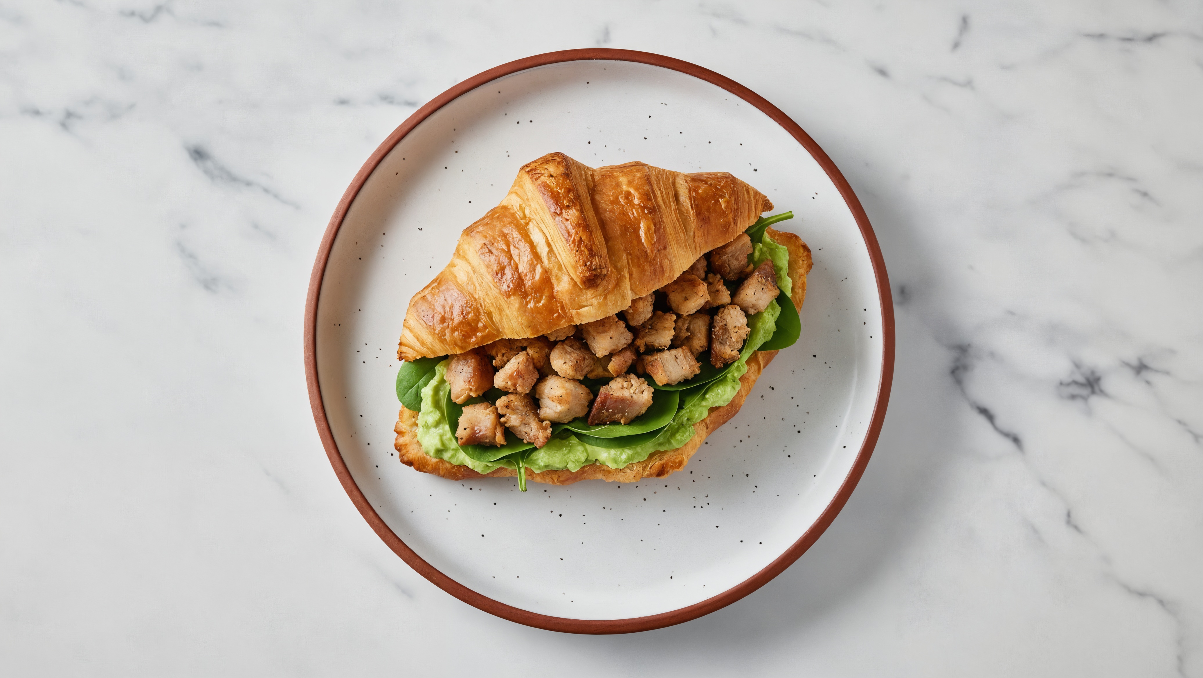 Cozy Guac'd Up Pork Carnitas on a Bun with Baby Spinach