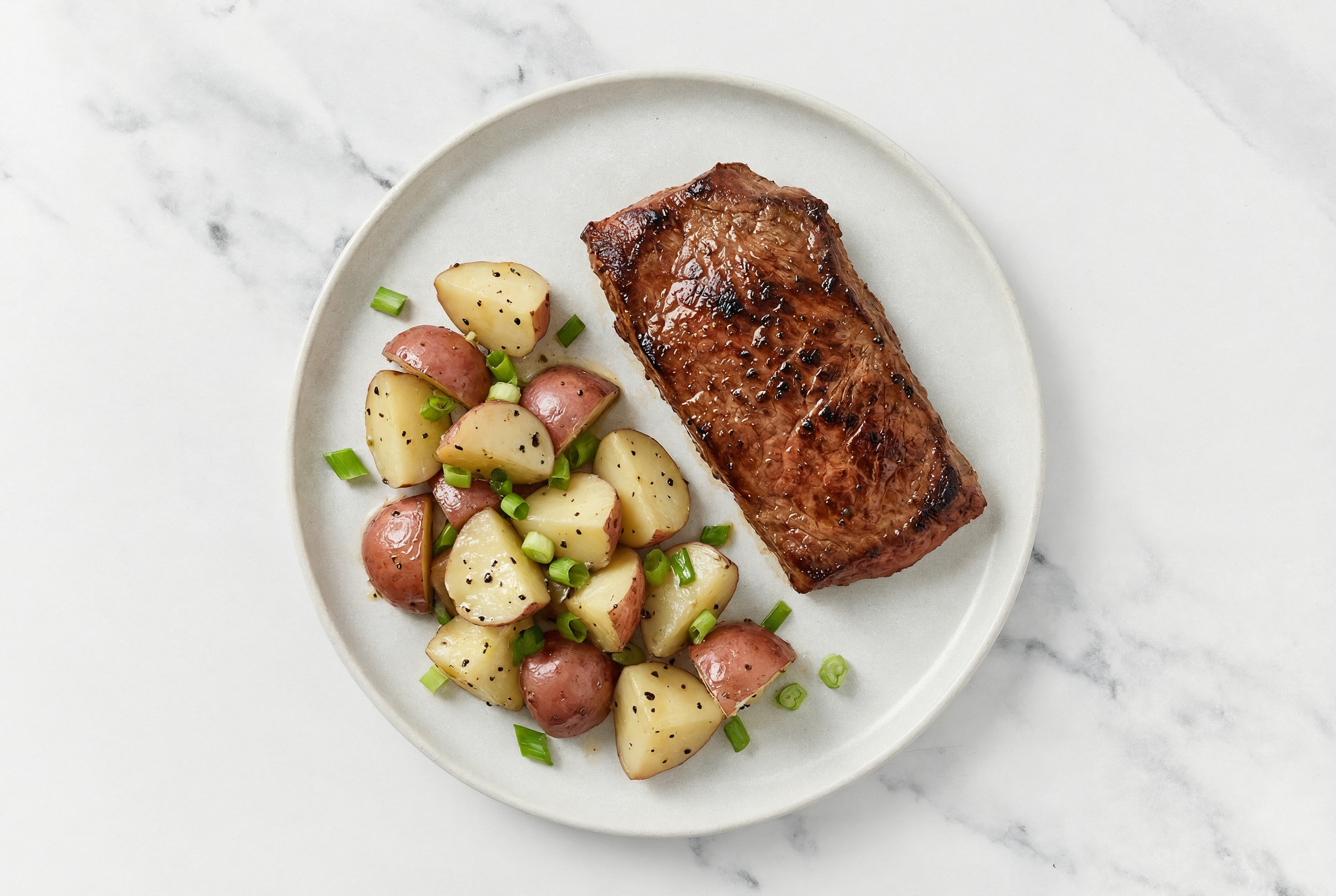 Adobo Marinated Flank Steak n' Slow Churned Lemon & Peppercorn Pasture Butter Pepper Red Potatoes