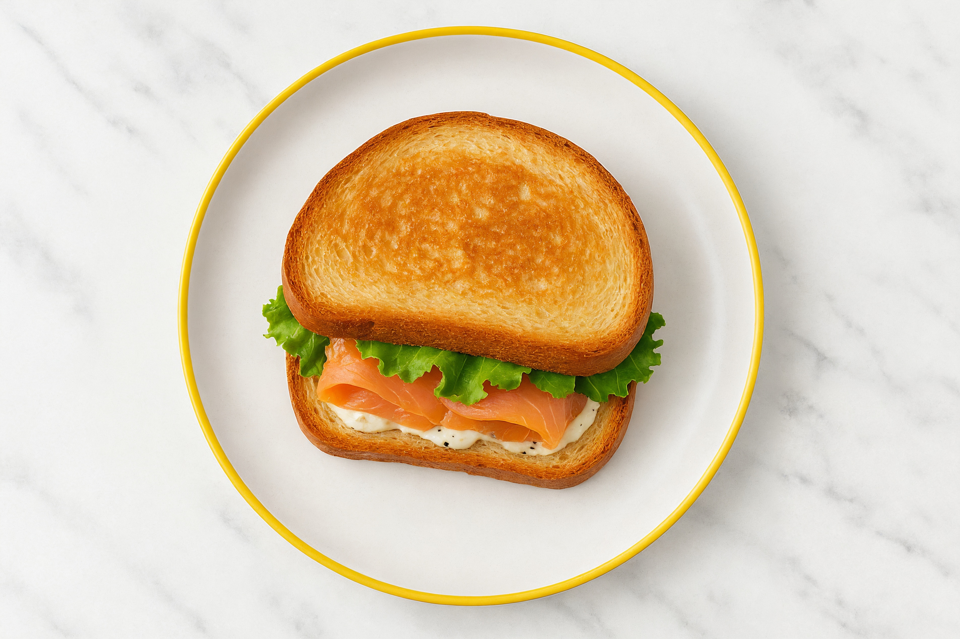 Dill Pickle Smoked Salmon Sandwich with Green Leaf Lettuce on Honey White Bread