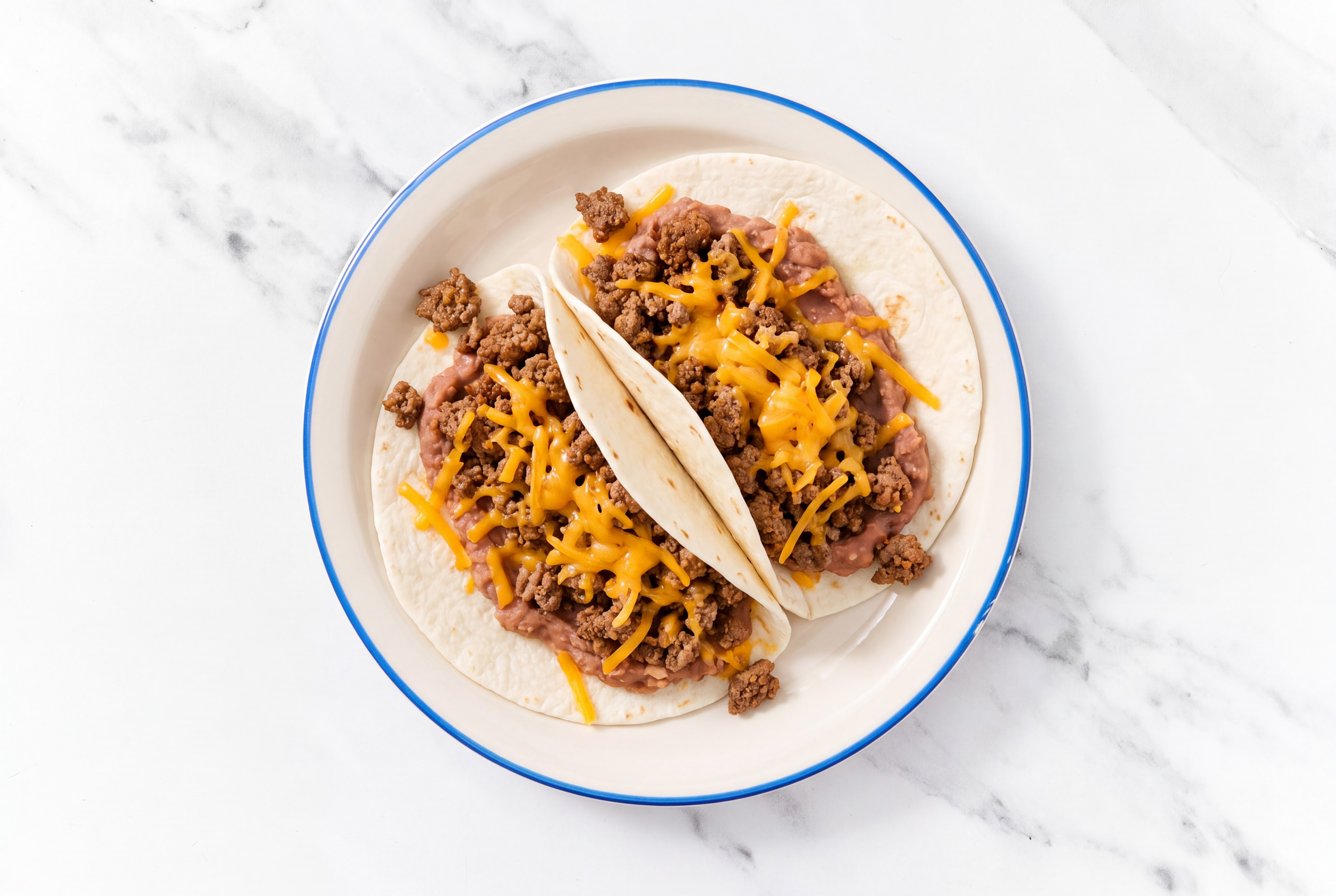 Ground 93/7 Lean Beef Tacos with Cheddar Cheese & Refried Red Beans