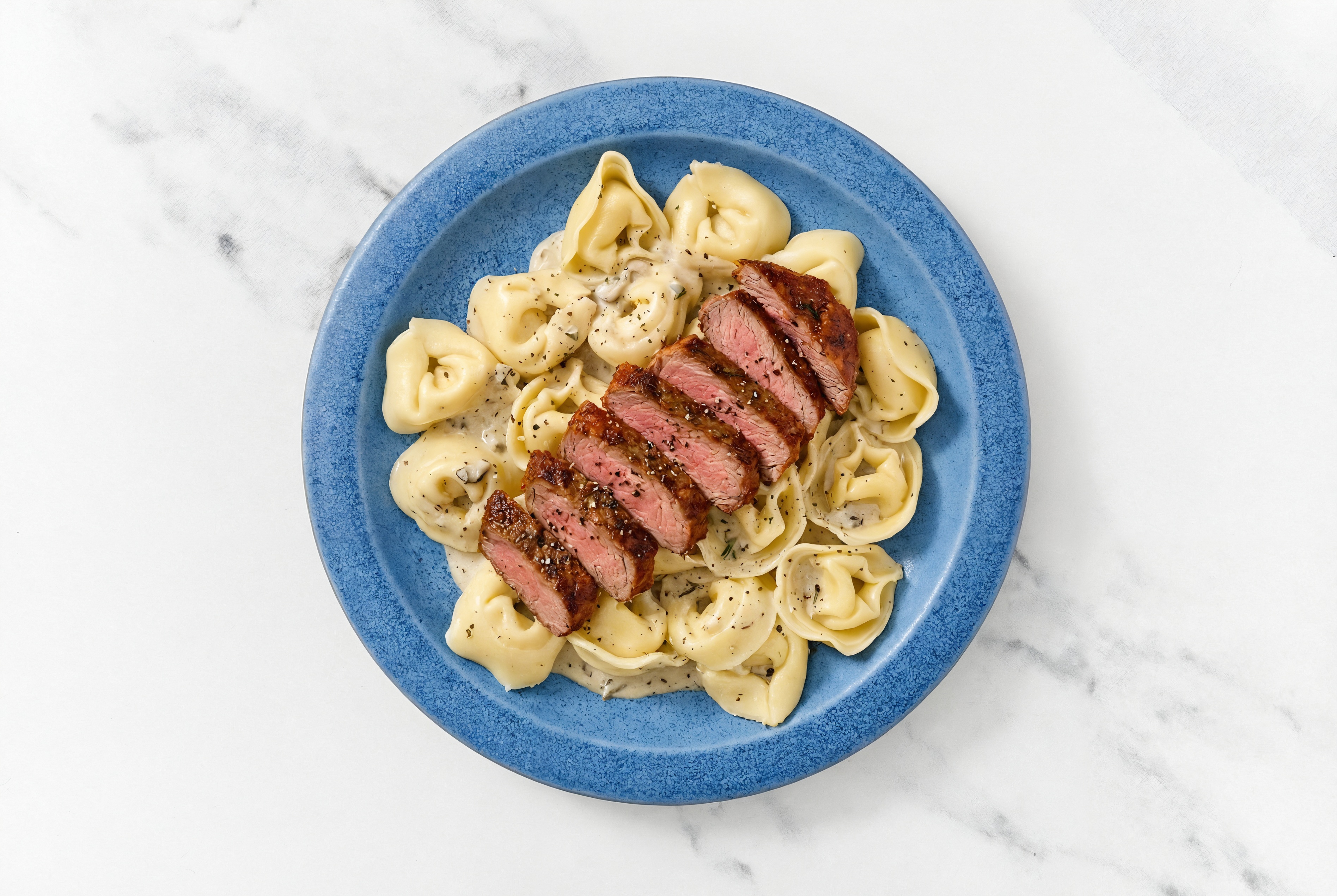 Steakhouse Cheese Tortelloni Truffle with Adobo Marinated Flank Steak