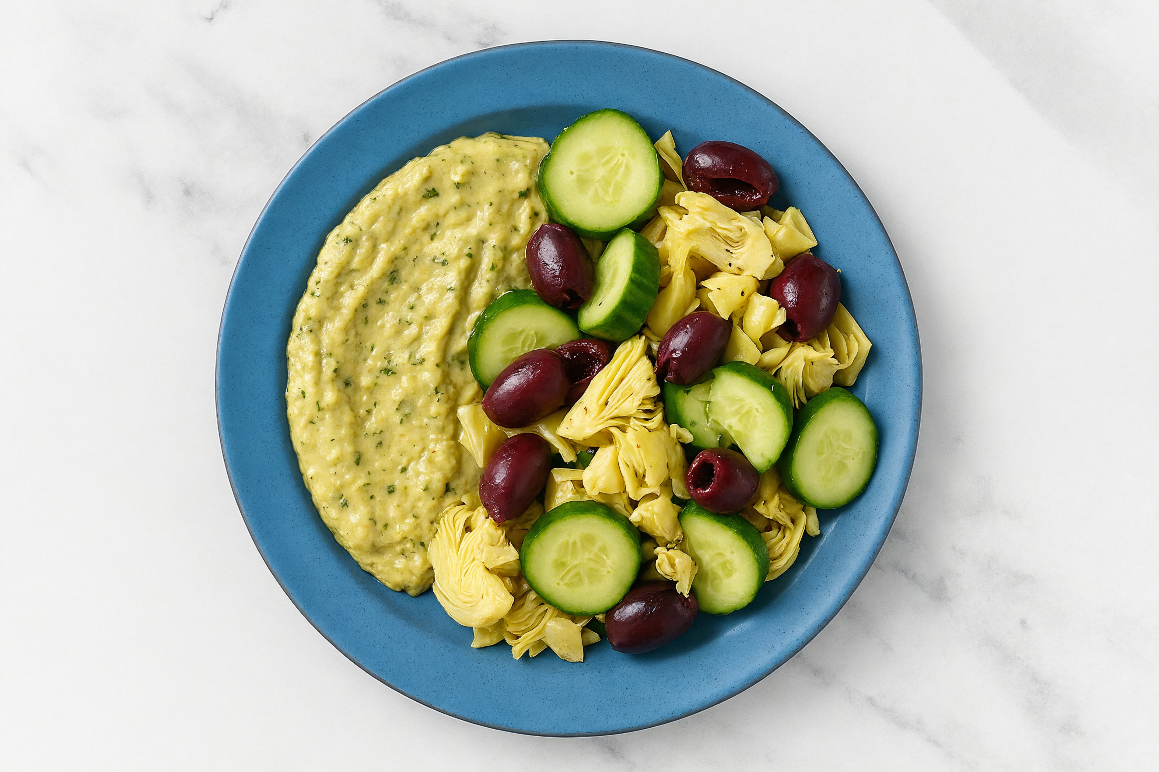 Olive Artichoke Cucumber Bowl over Spinach Artichoke Dip