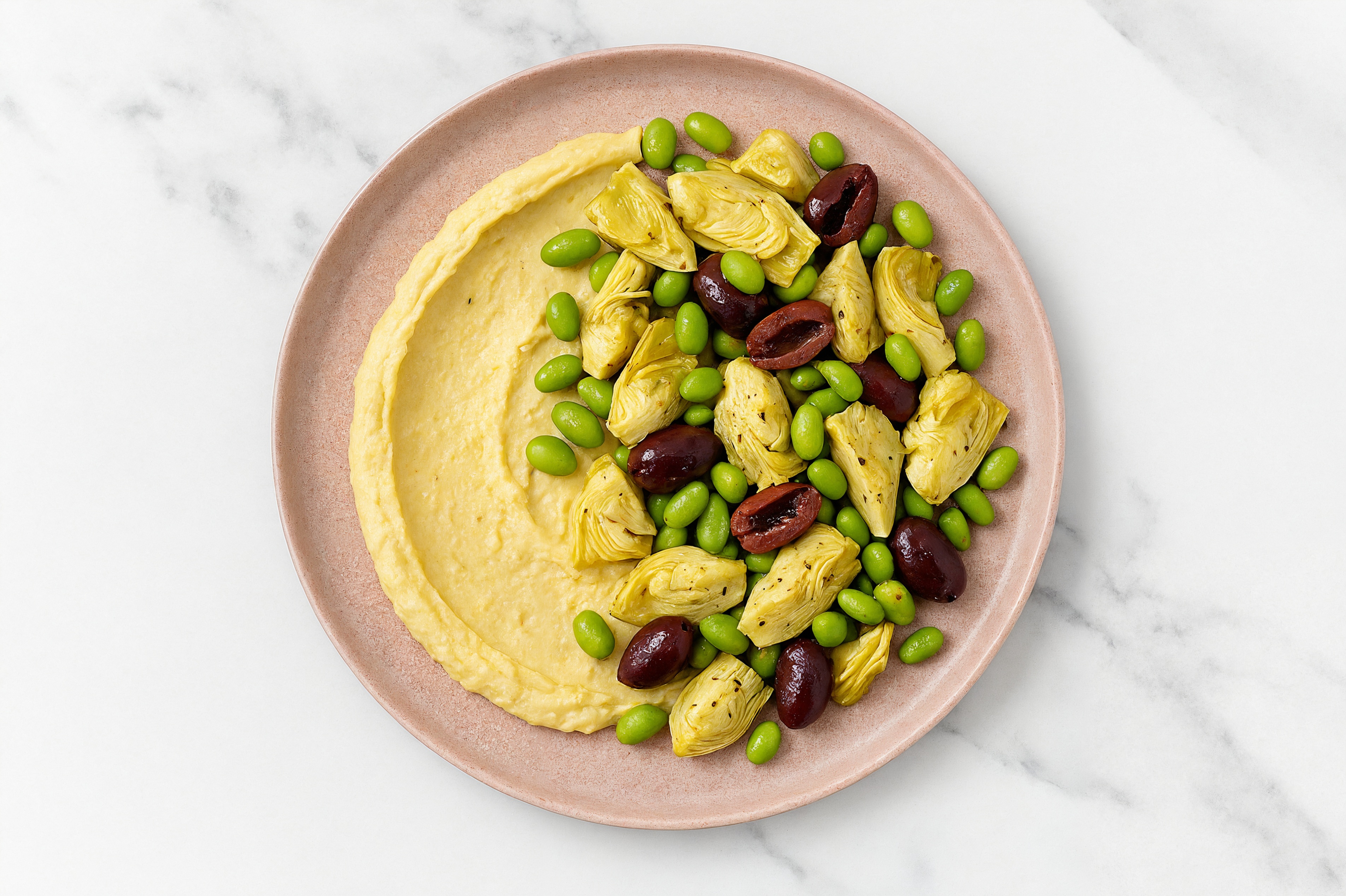Olive Artichoke Edamame Bowl over Lemon Garlic Hummus