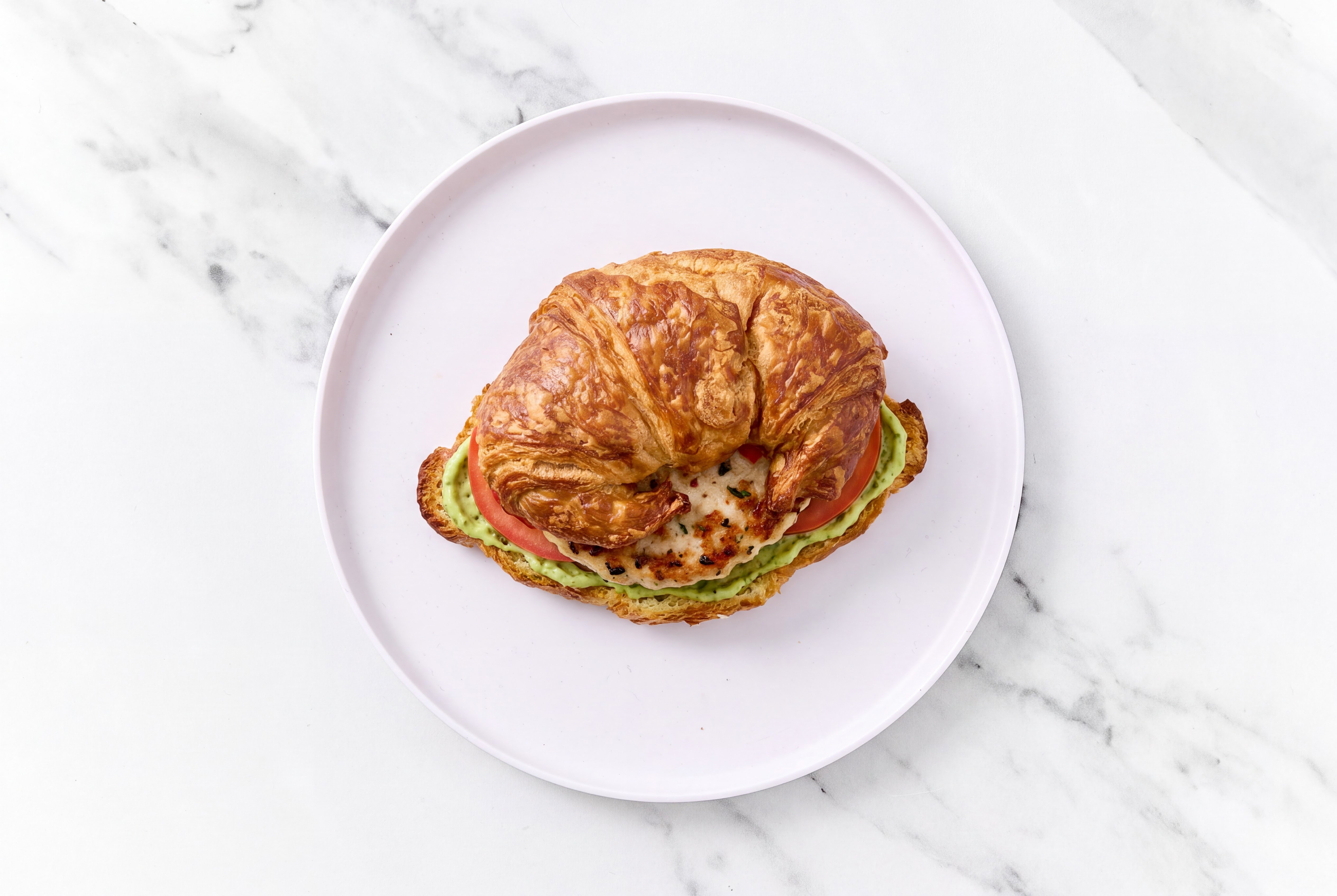 Bruschetta Chicken Patties with Tomatoes + Pesto Aioli on Croissant Buns