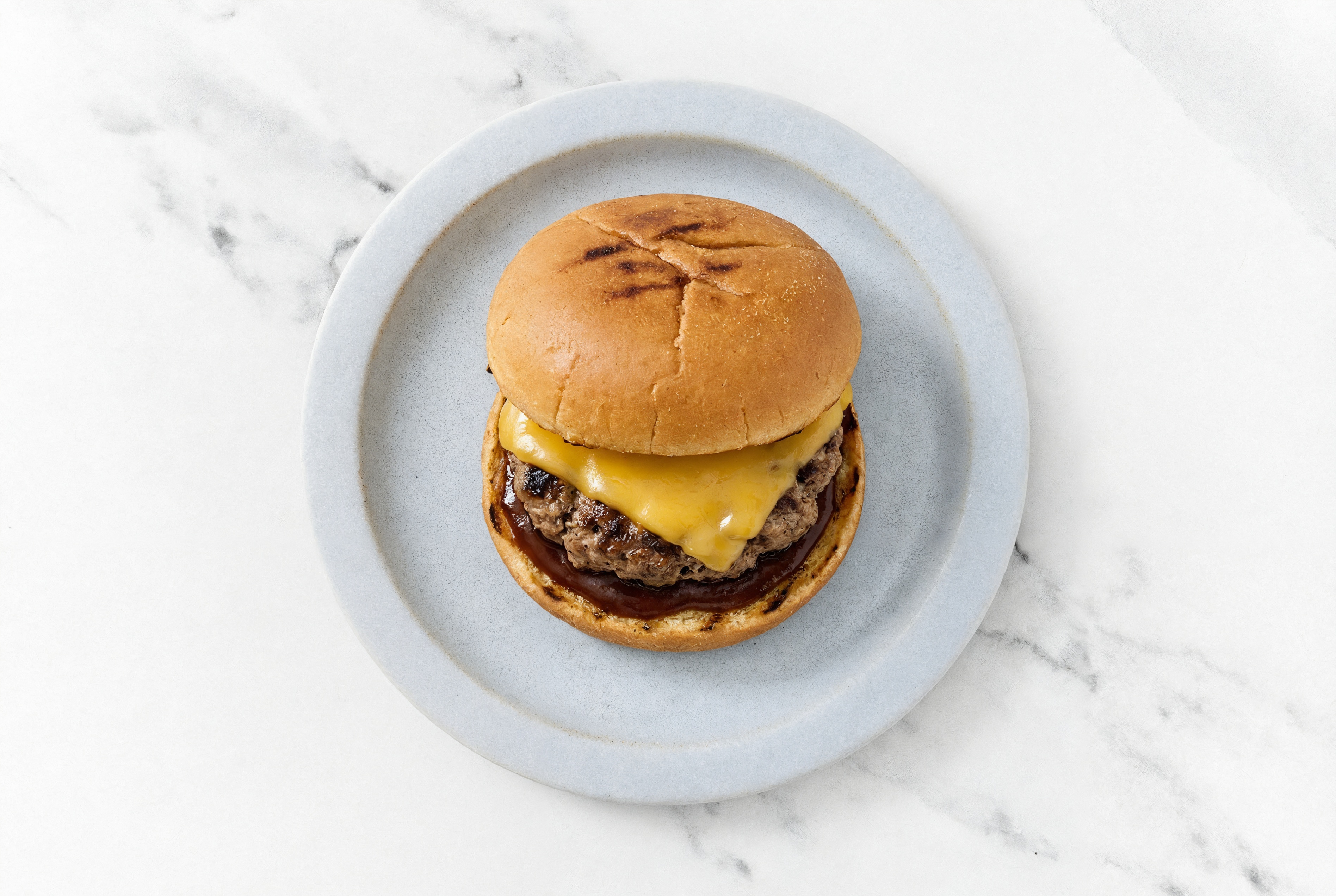 Hearty Grilled BBQ Bison Cheeseburger with Original BBQ Sauce