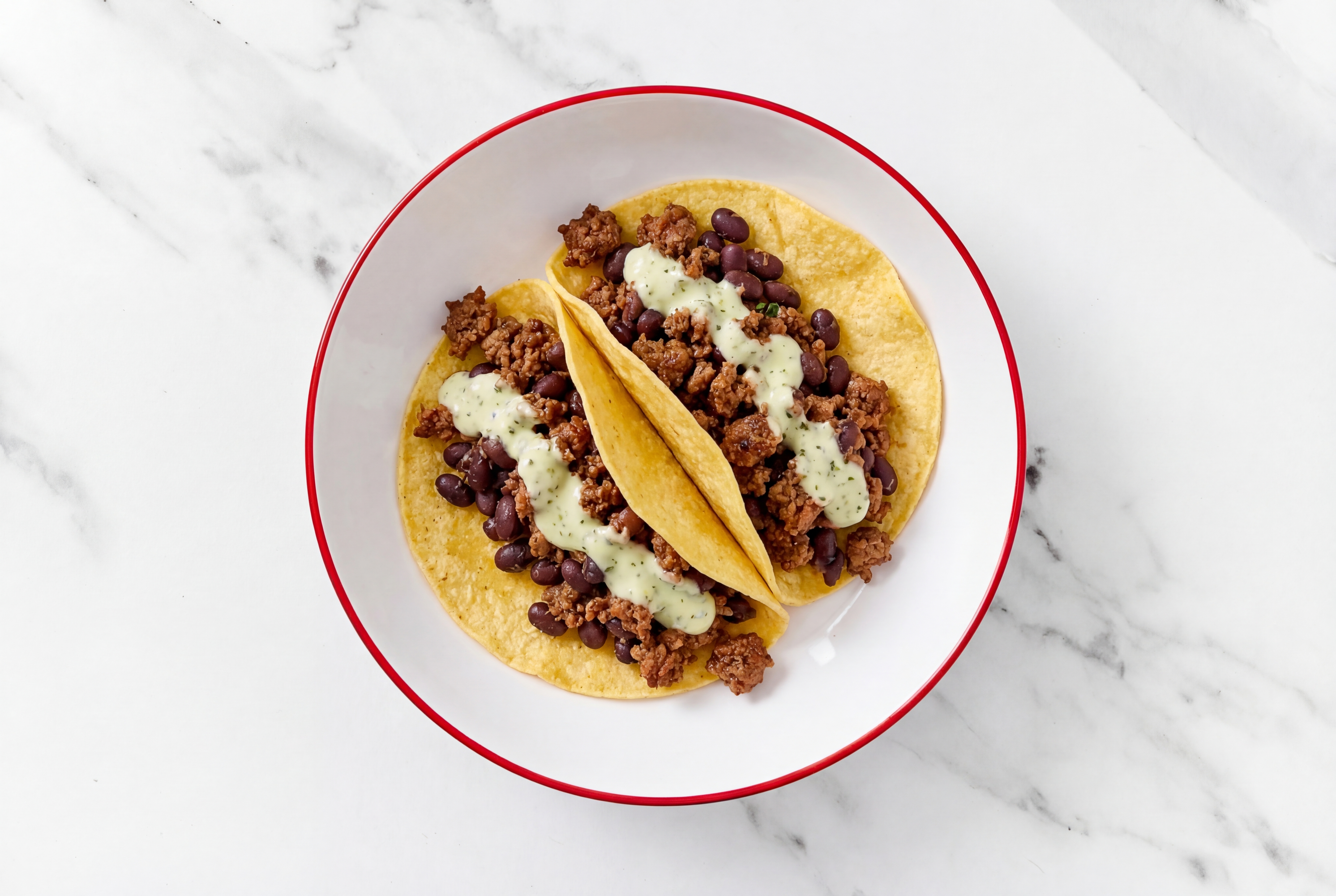 Herby Mexican-Style Ground Beef Tacos with Jalapeño Crema & Spiced Beans