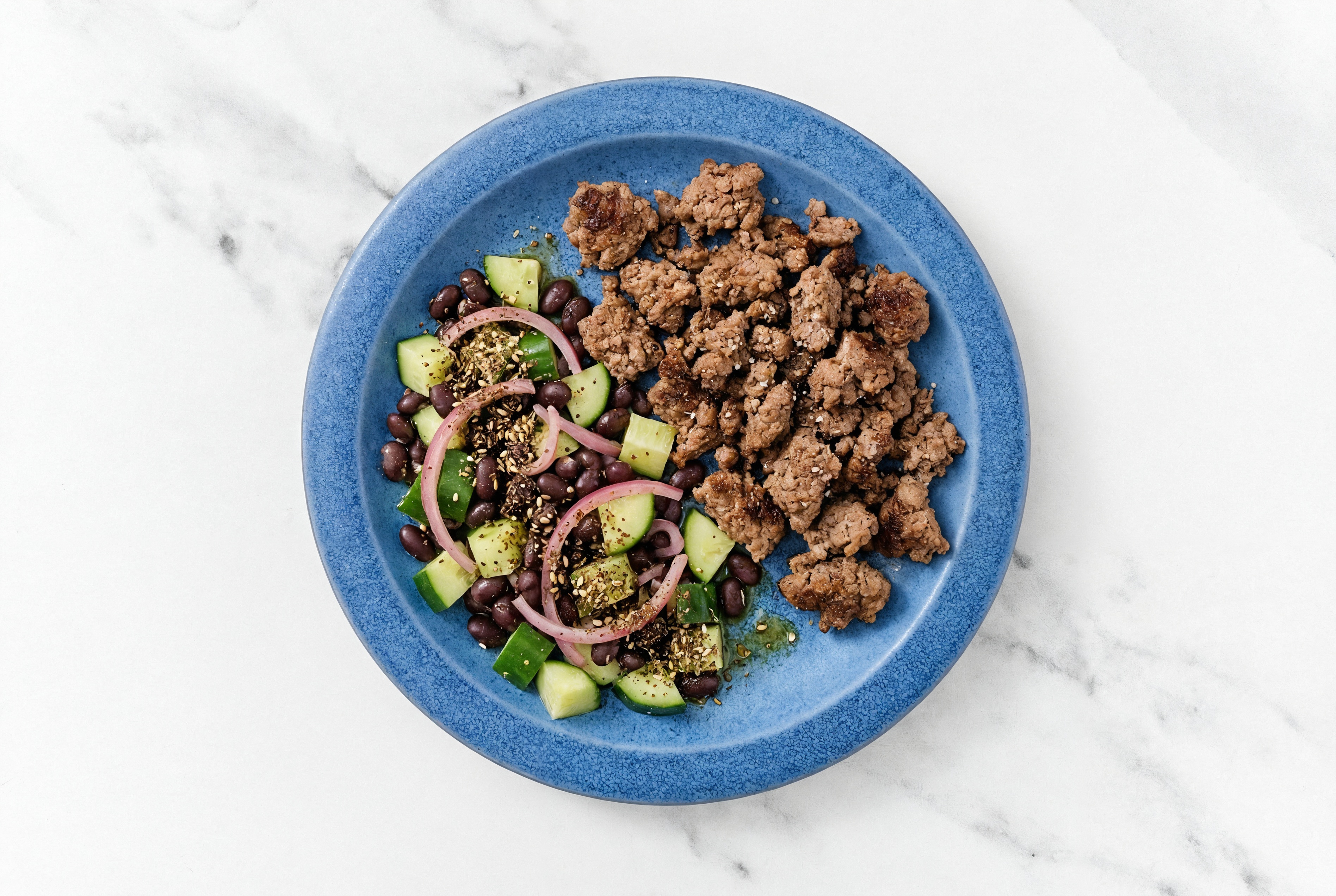 Za'atar-Spiced Ground Bison Bowl with Black Bean Beans, English Cucumber, and Pickled Red Onions