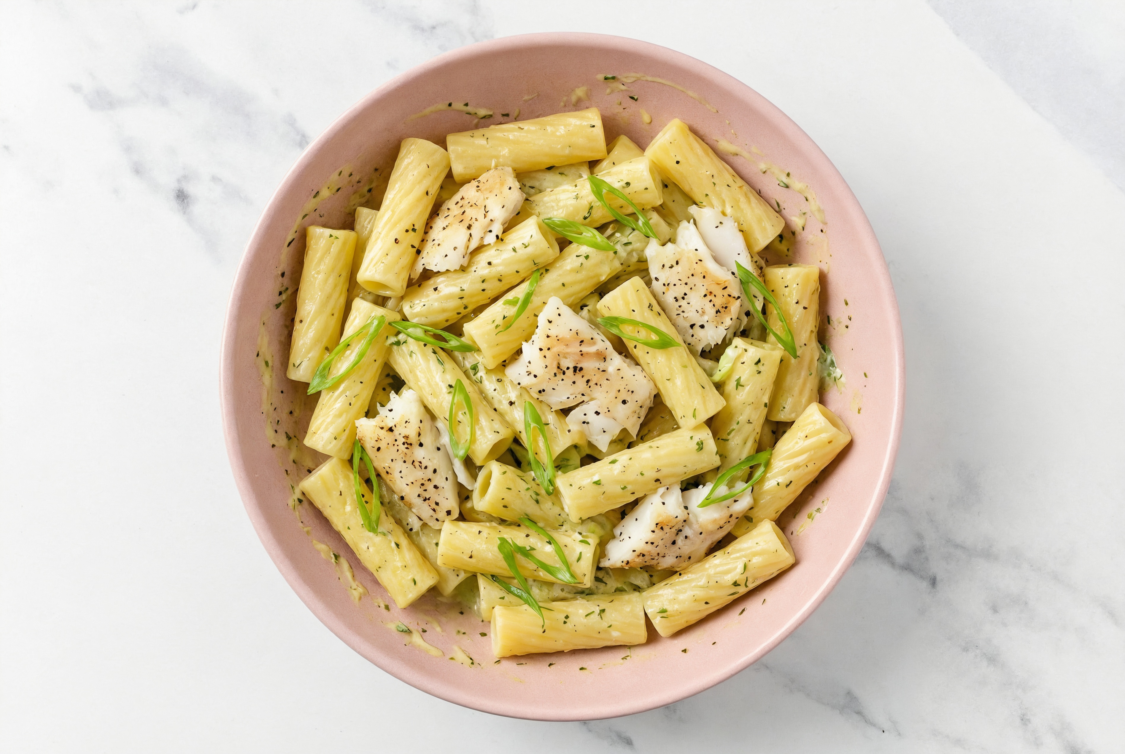 Herby Cod Rigatoni with Artichoke Hearts + Fresh Scallions