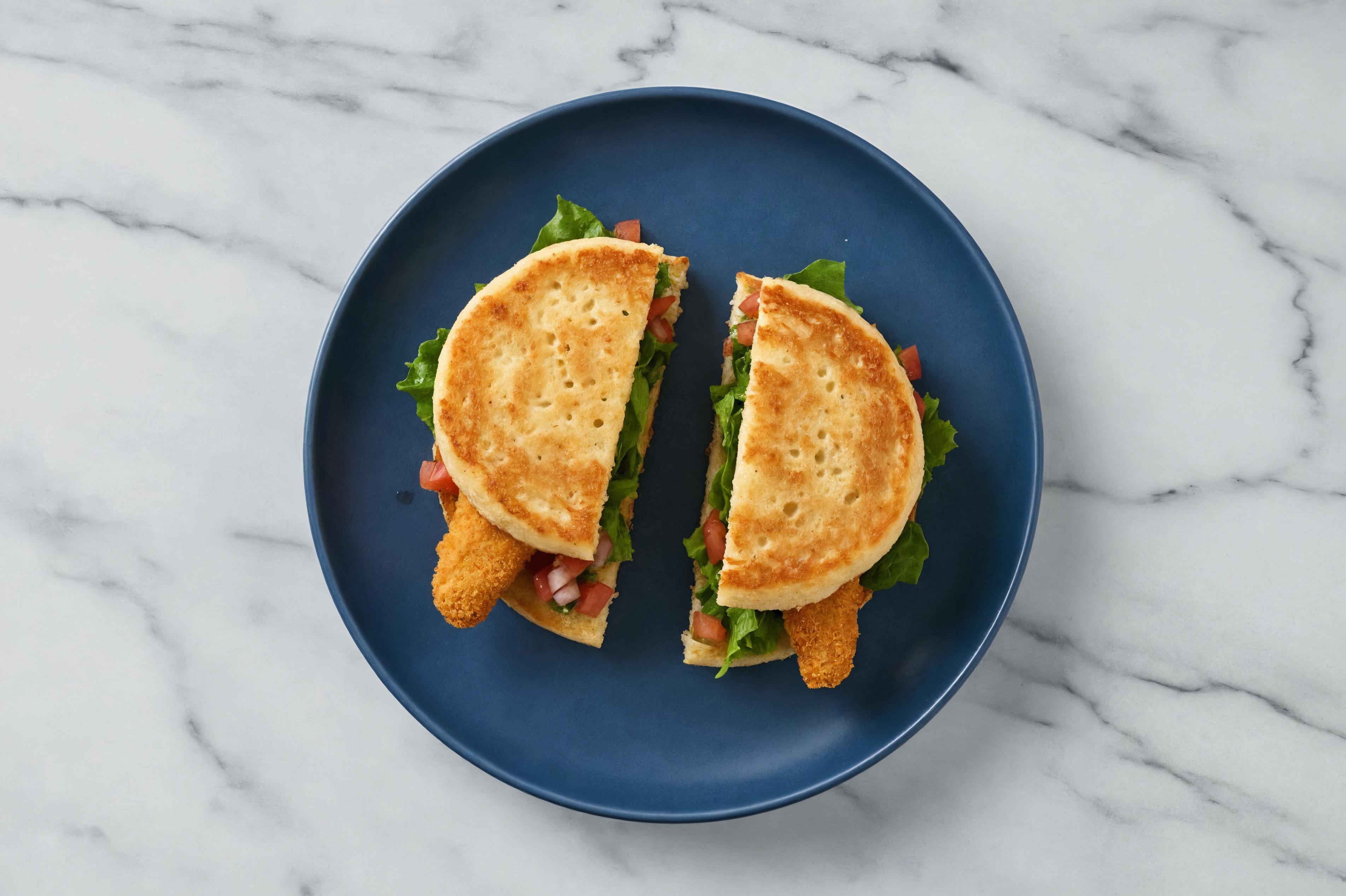 Mexican "Chicken" Tenders Sandwich with Green Leaf Lettuce on Cauliflower Rounds