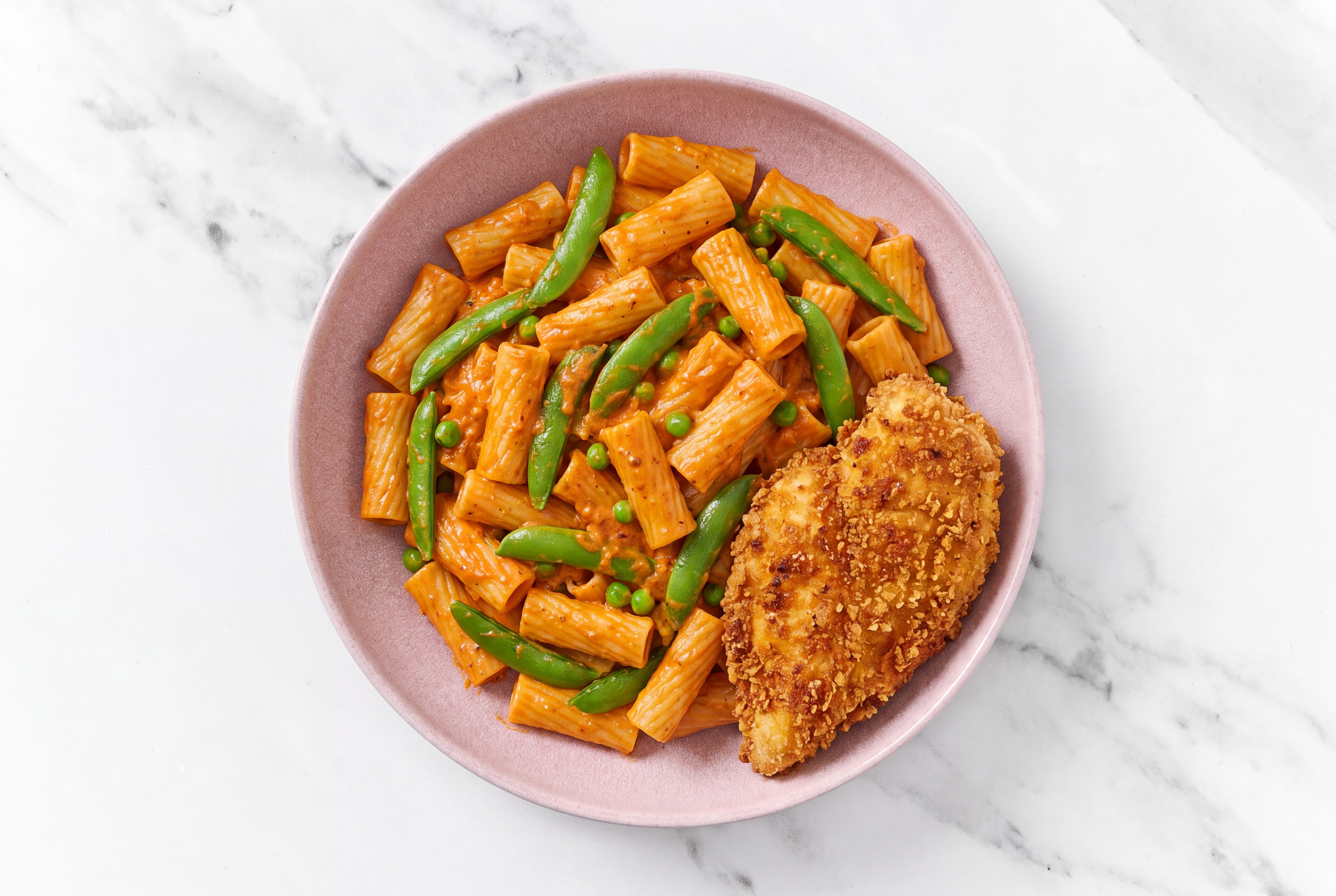 Crispy Hot Honey Chicken over Creamy Vodka Rigatoni with Snap Peas