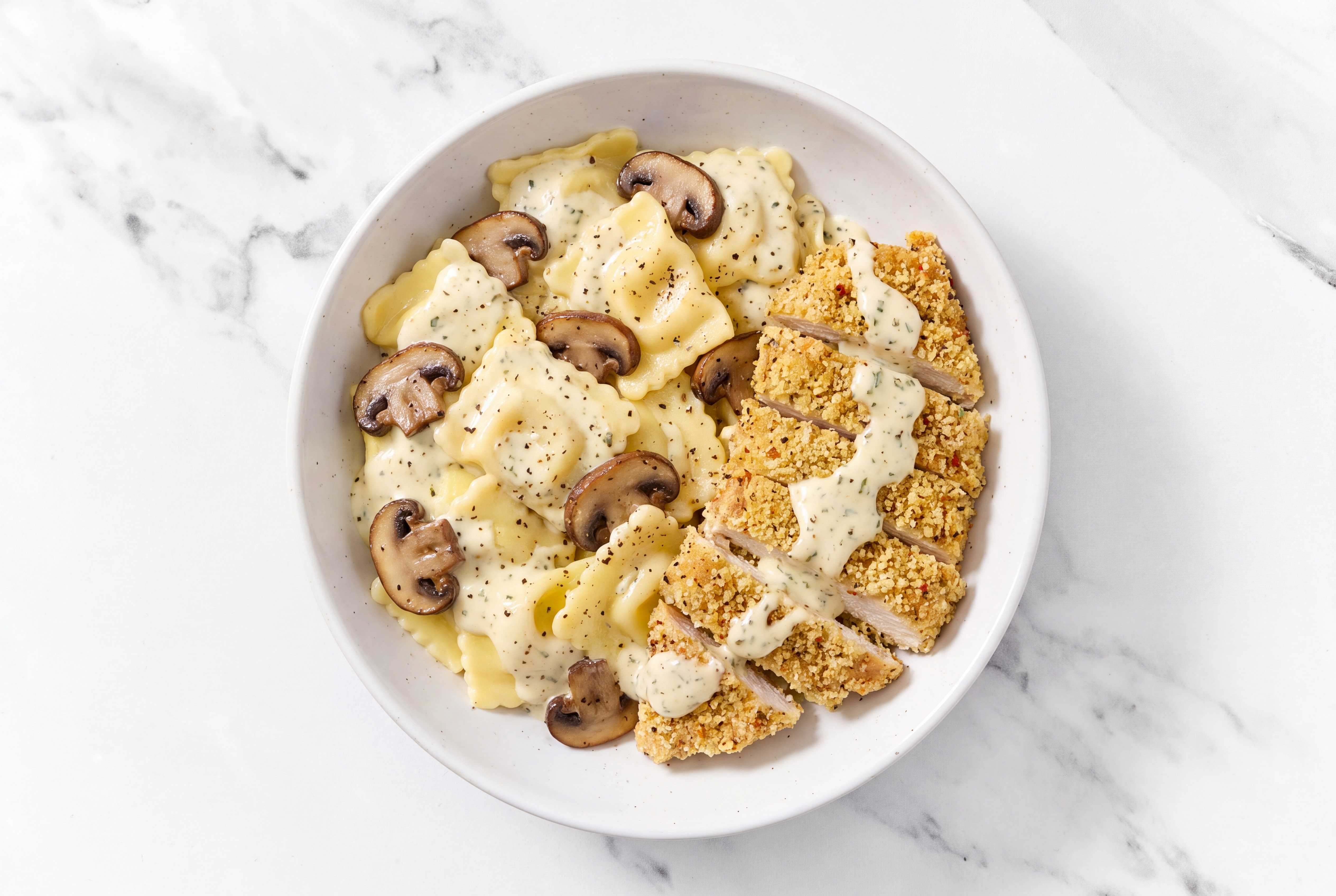 Crispy Garlic Chicken over Creamy Ravioli with Baby Bella Mushrooms