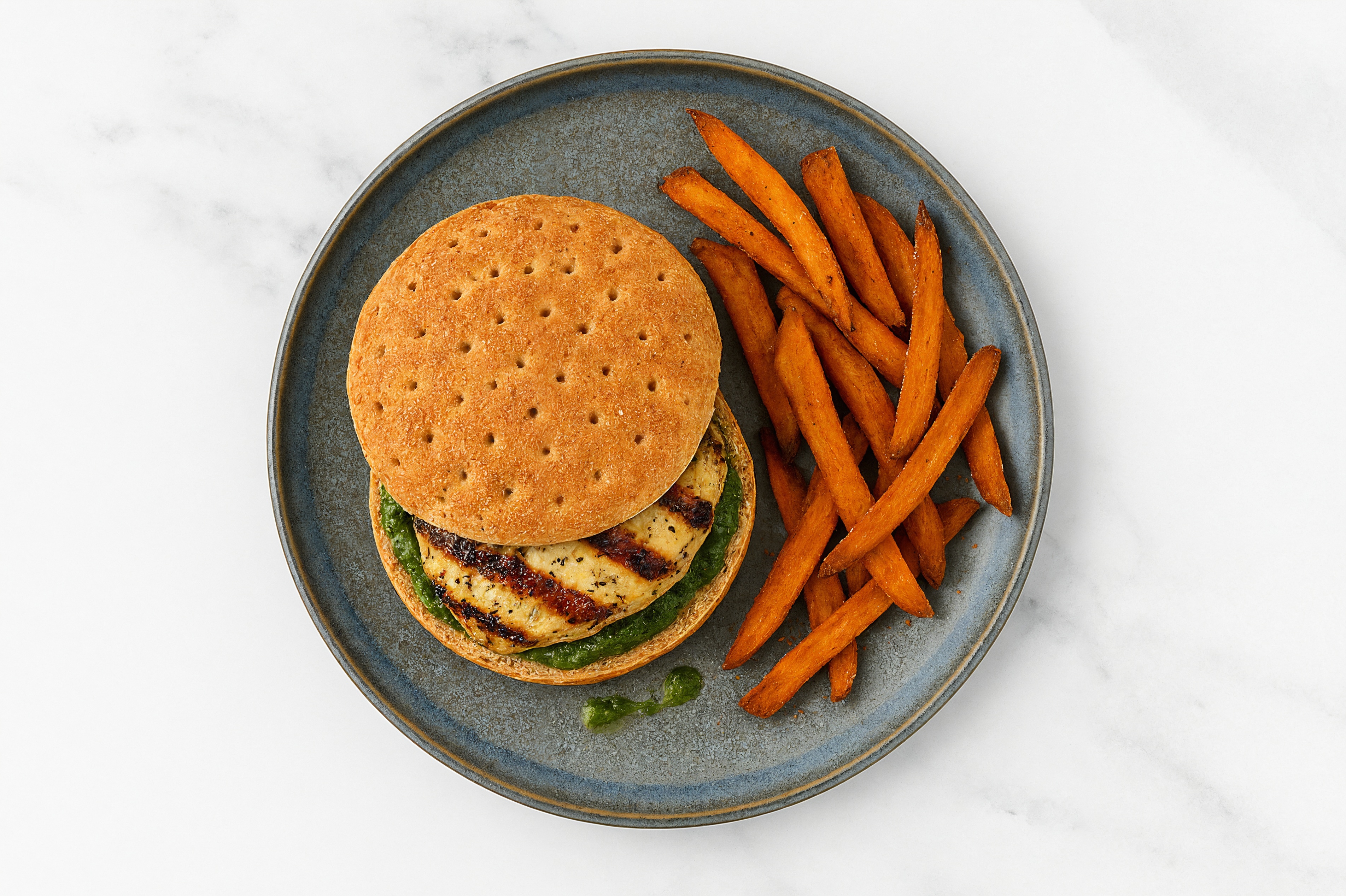 Pesto Mediterranean Grilled Chicken Breast Sandwich with Sweet Potato Fries