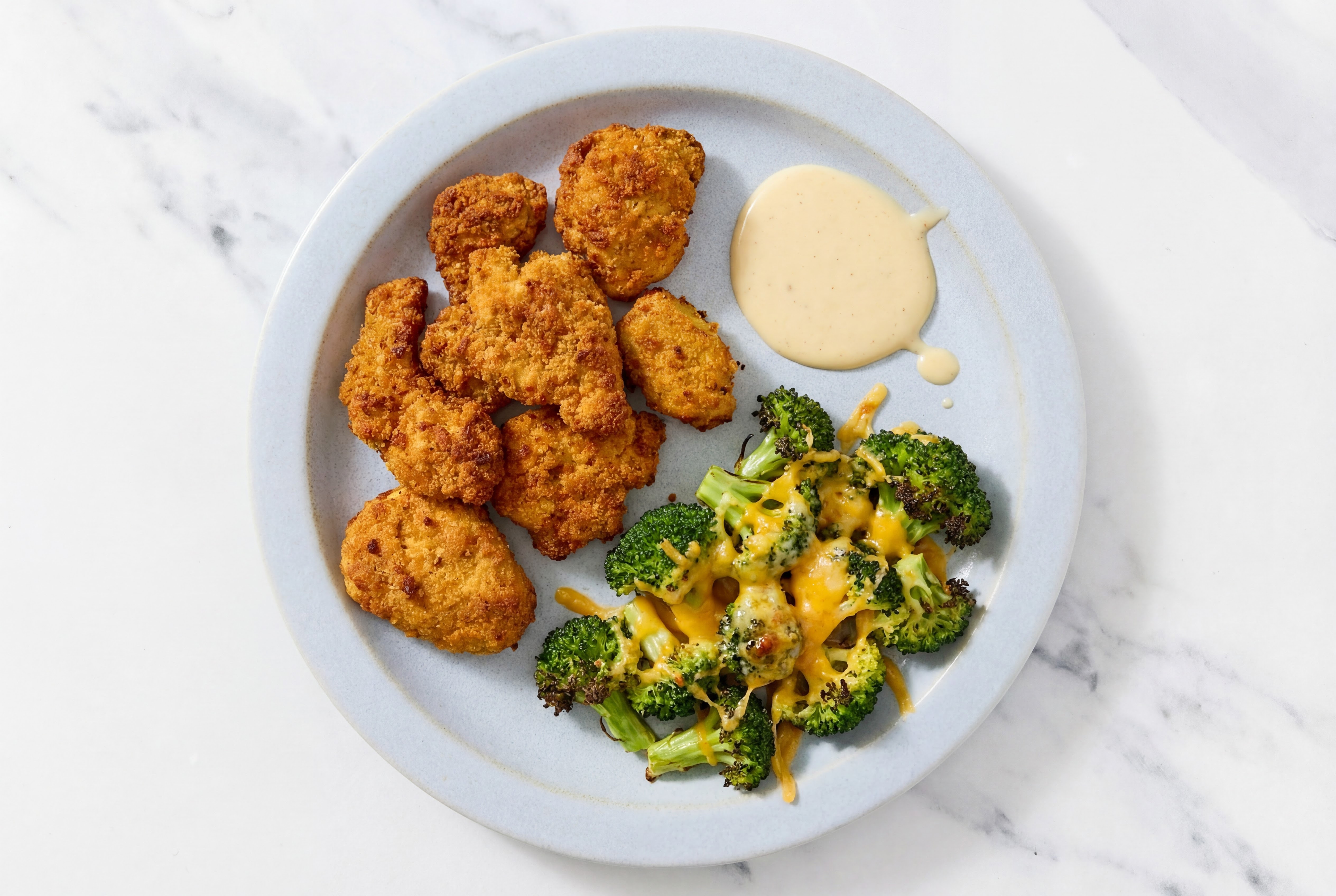 Buffalo Chicken Nuggets + Cheesy Broccoli with Miso Caesar with Sharp Cheddar Bar
