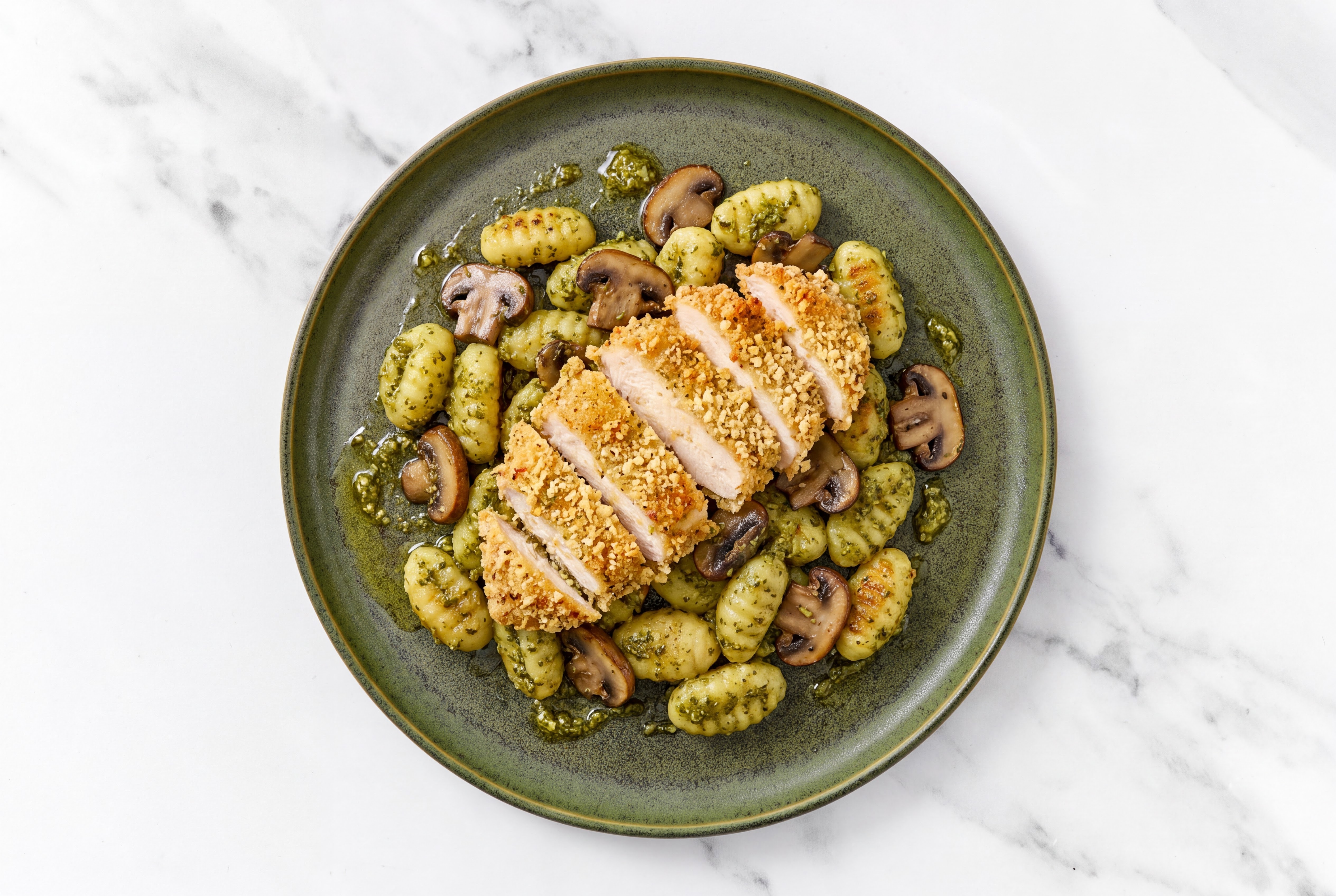 Crispy Garlic Chicken over Pesto Gnocchi with Baby Bella Mushrooms