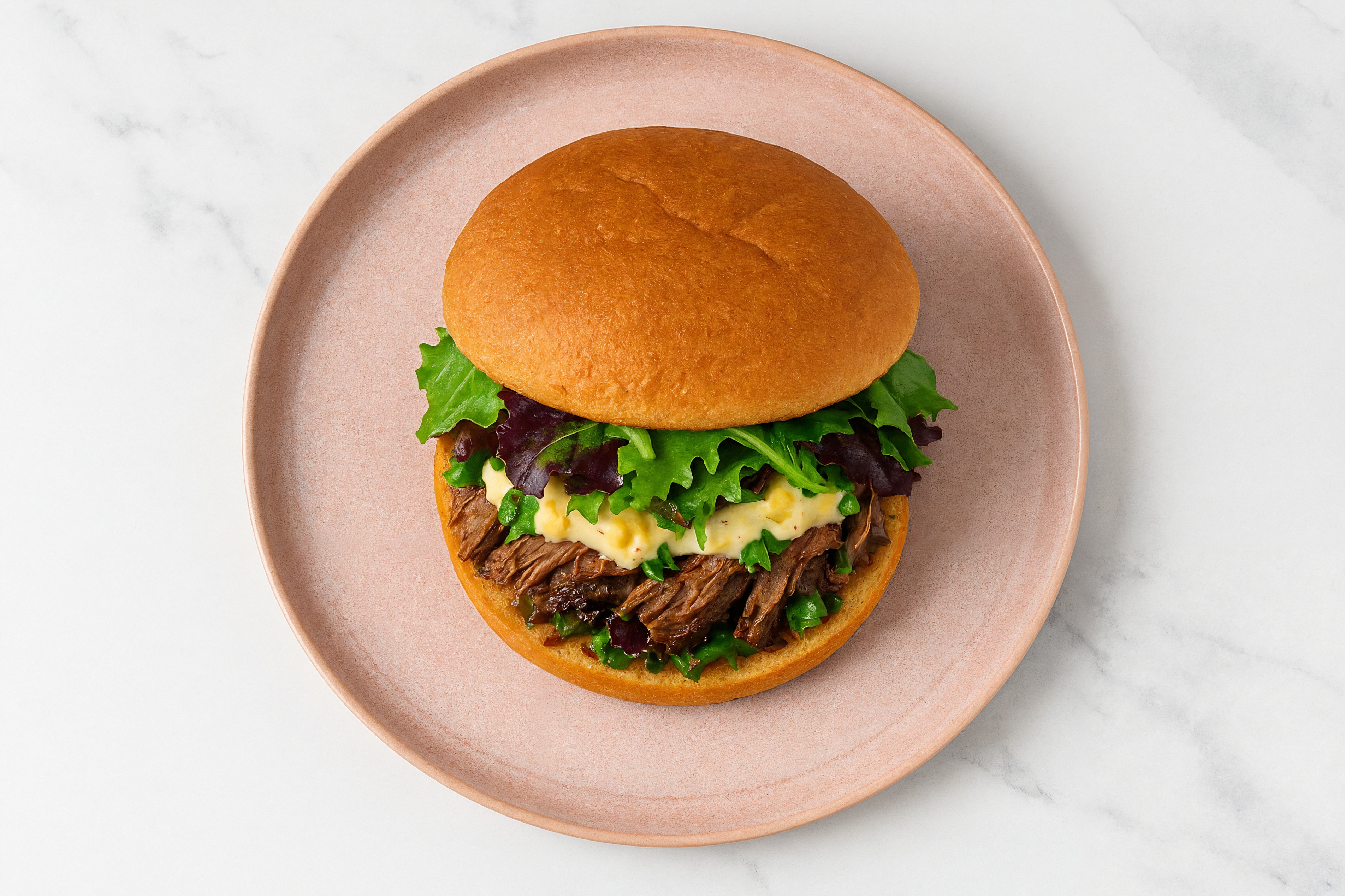 Street Corn Beef Short Rib Sandwich with Spring Mix on Gluten-Free Buns