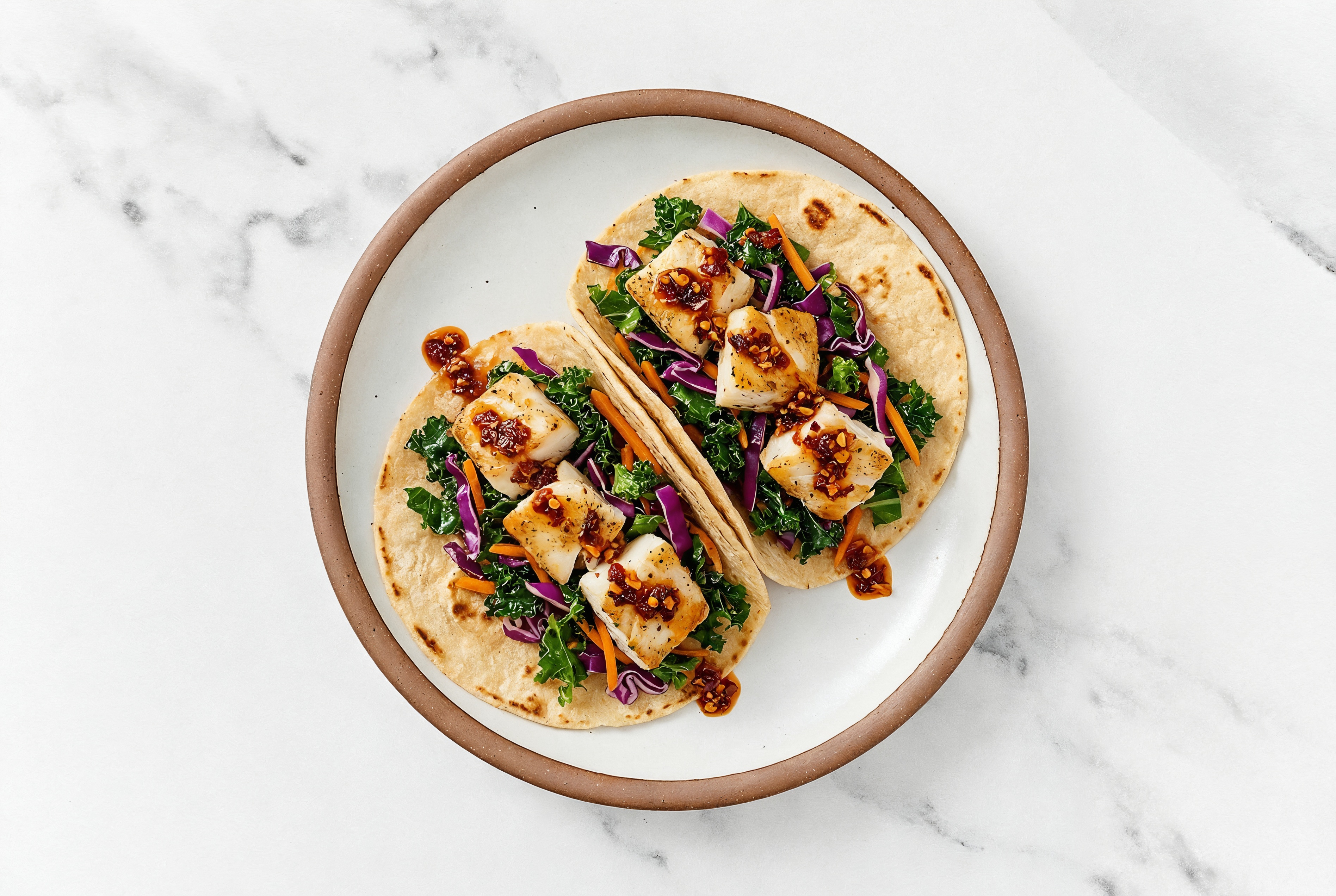 Chili Crisp Lime Halibut Tacos with Sautéed Kale Mix