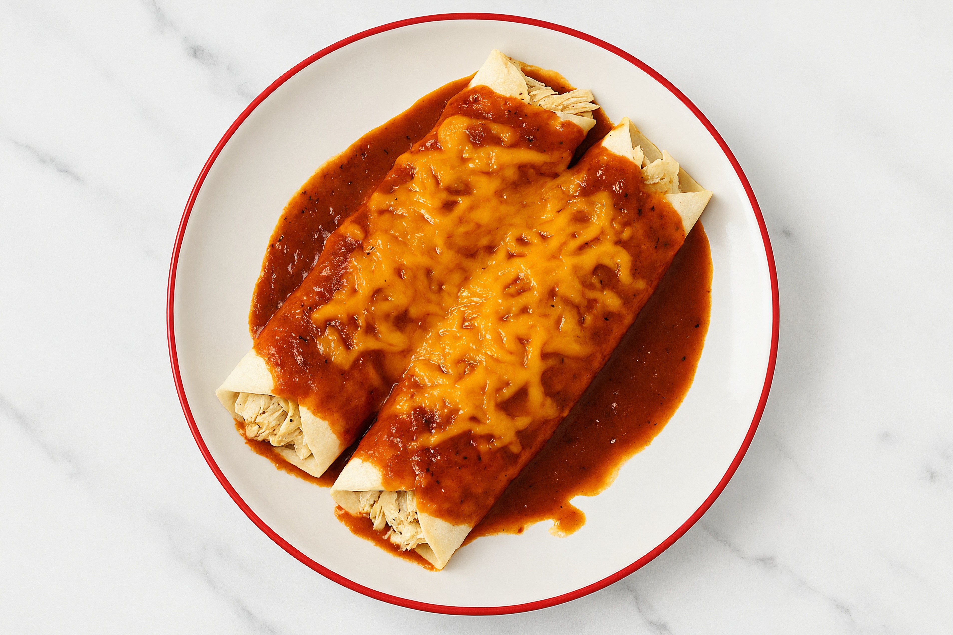 Zesty Pulled Chicken Protein Enchiladas Rojas with Shredded Sharp Cheddar Cheese