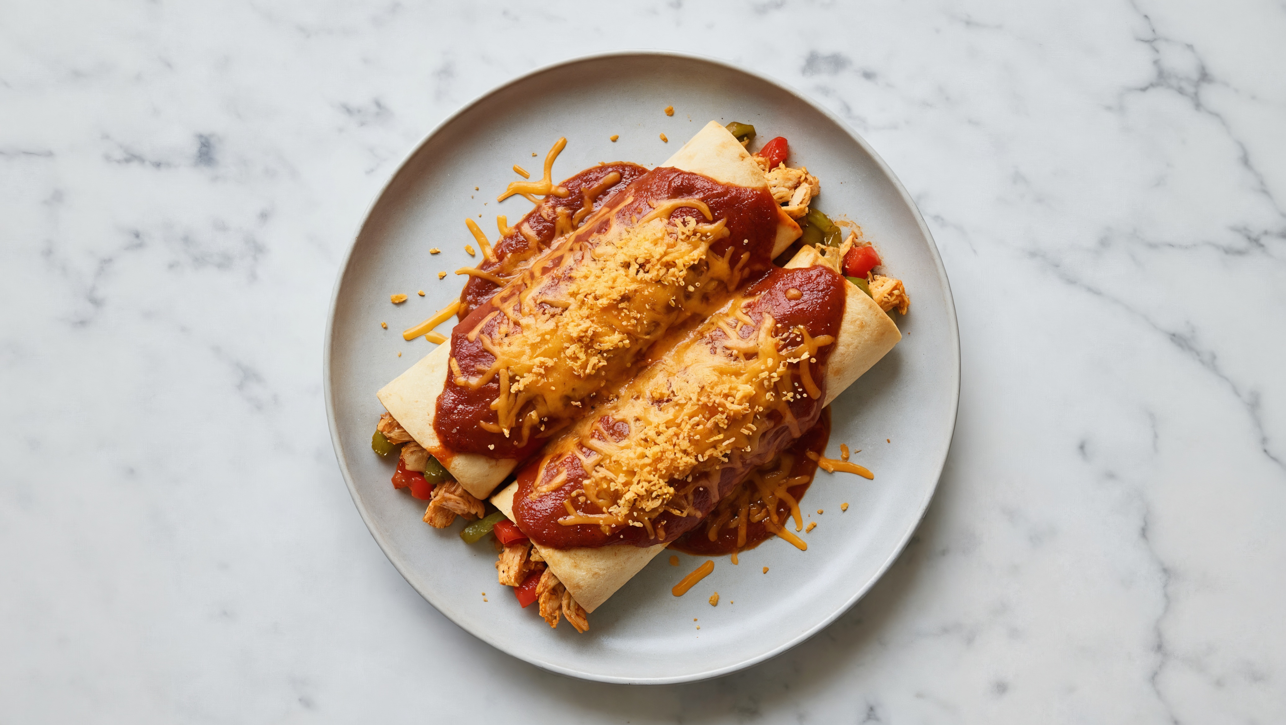 Herby Fiber-Friendly Chicken Enchiladas Rojas with Shredded Sharp Cheddar Cheese